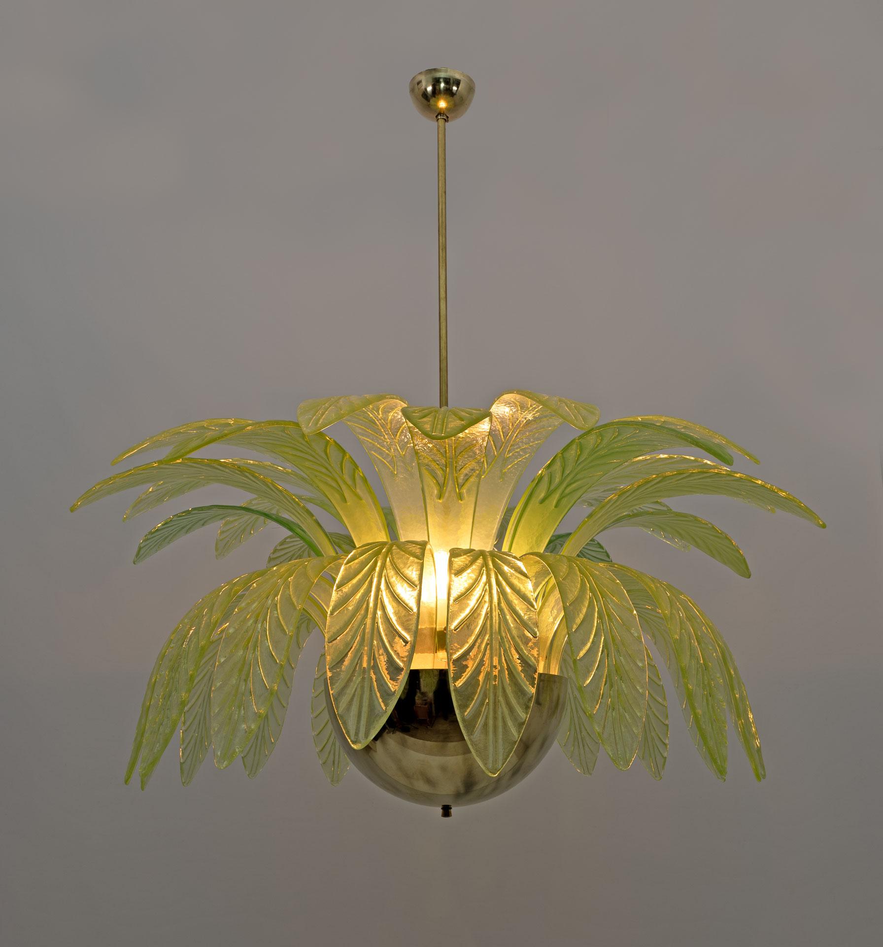 Large mouth-blown Murano glass chandelier, 38 green Murano glass leaves, brass structure, 12 bulbs. The chandelier reproduces the crown of a palm tree. We supply reducers for E12 USA bulbs. The minimum height, if you want to shorten the brass rod,