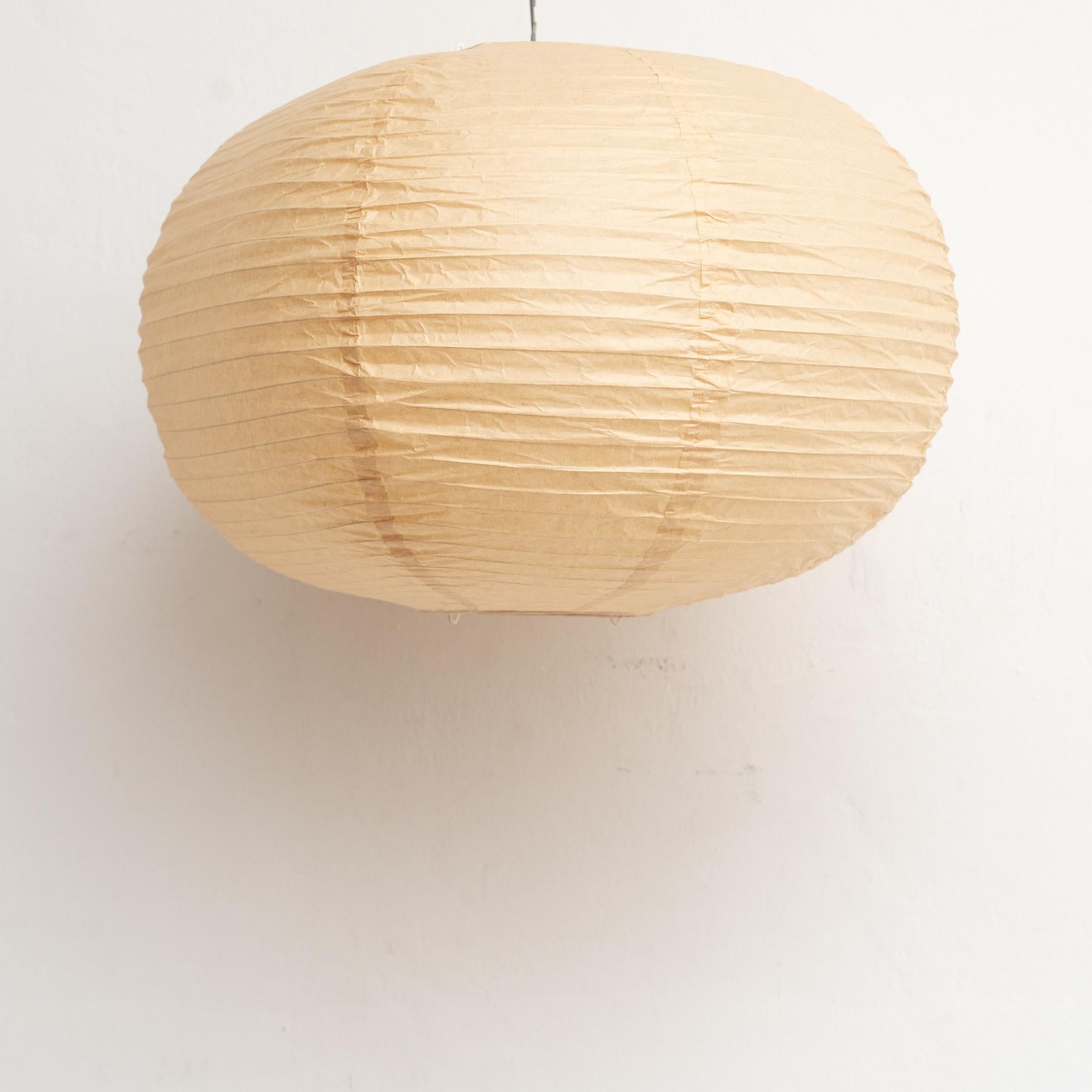 Mid Century Modern Paper Lamp After Isamu Noguchi

By unknown manufacturer, circa 1990.

In good original condition, with minor wear consistent of age and use, preserving a beautiful patina.

Paper shade only, no electrification or bulb included.