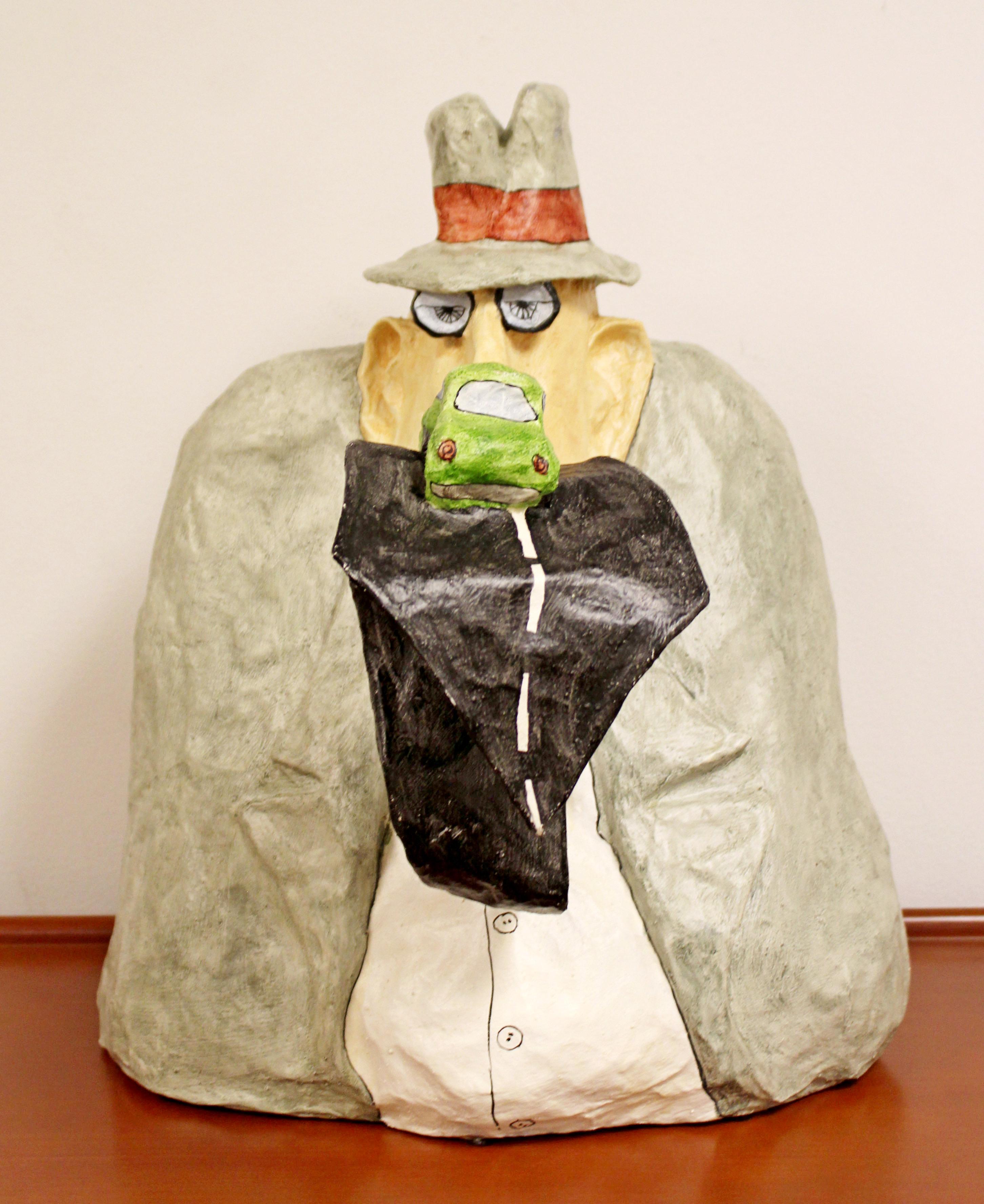 For your consideration is a fun, papier mâché table sculpture of a man with a Surrealist tie, signed and dated by Stephen Hansen, 1973. In excellent condition. The dimensions are 14