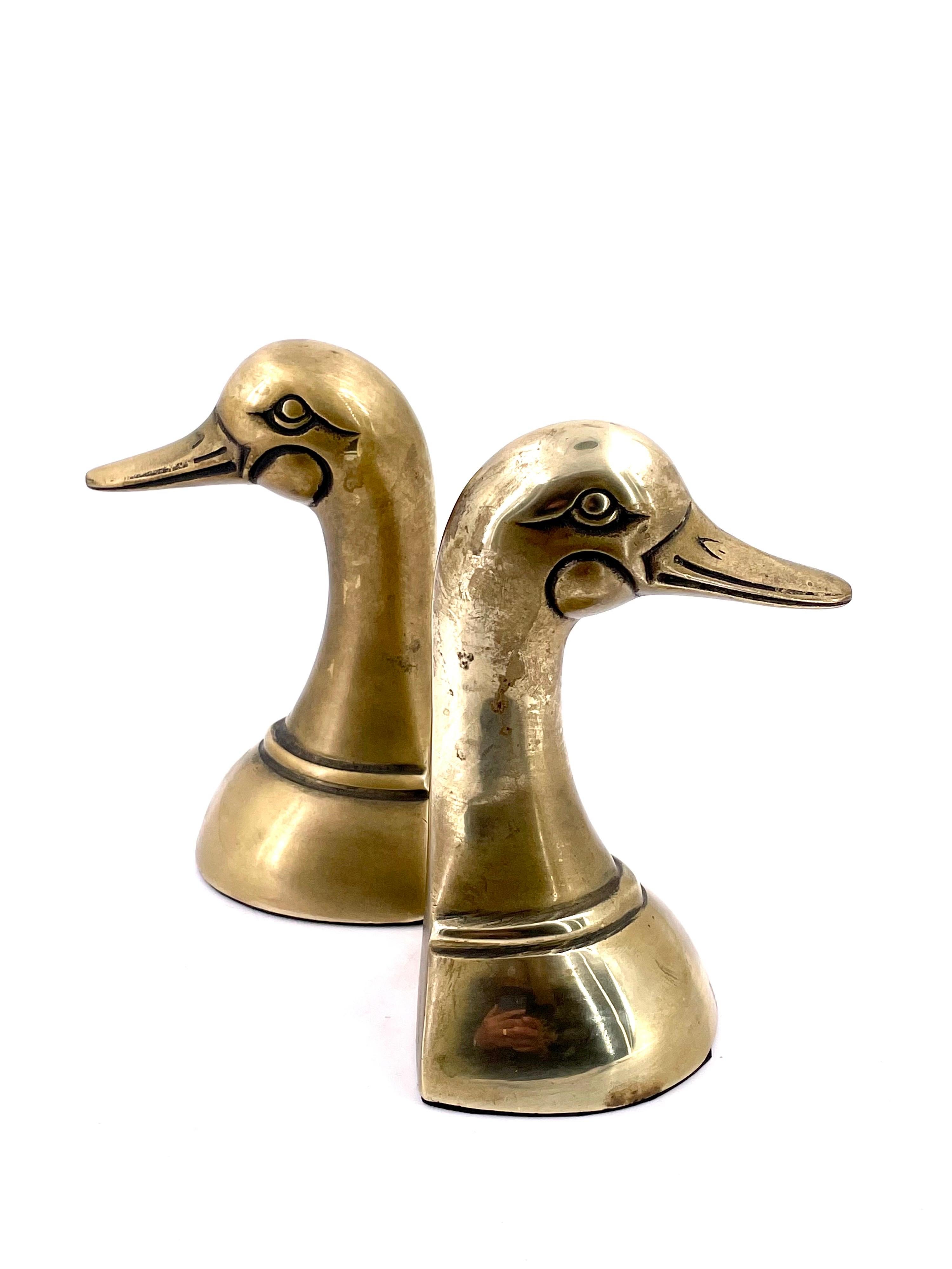 Nicely light polished brass bookends, duck heads, circa 1970s.