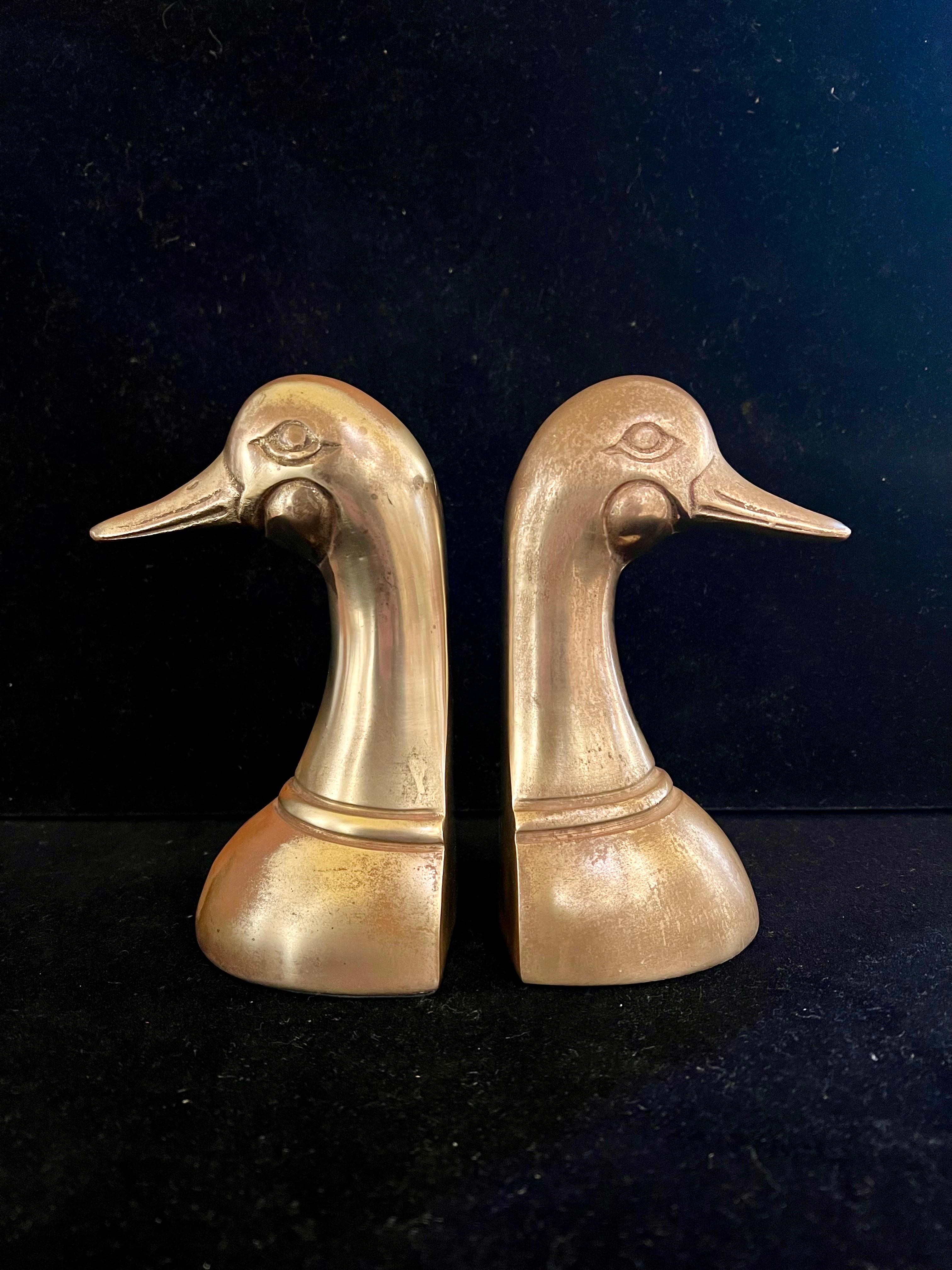 Nicely patinated solid brass bookends, duck heads, circa the 1970s.
