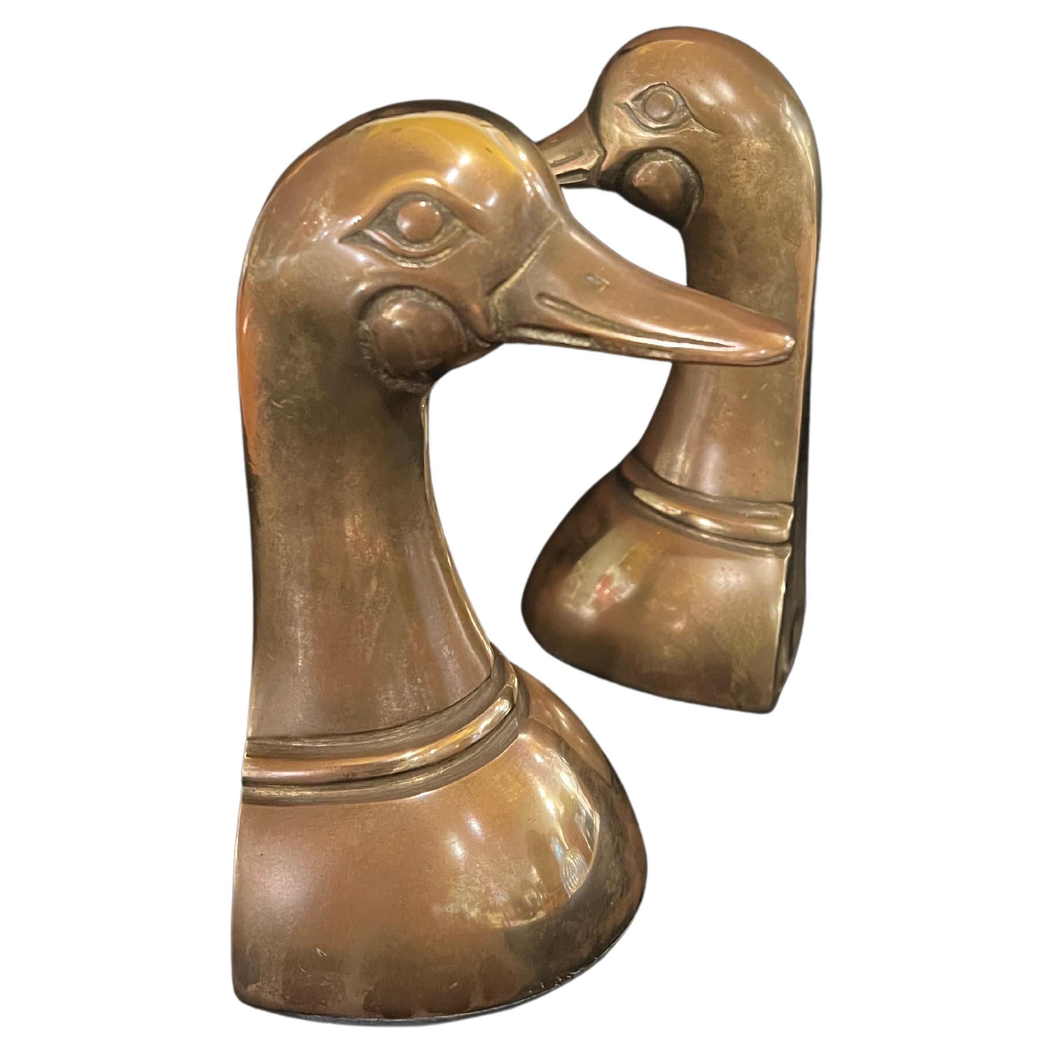 Nicely patinated solid brass bookends, duck heads, circa the 1970s.