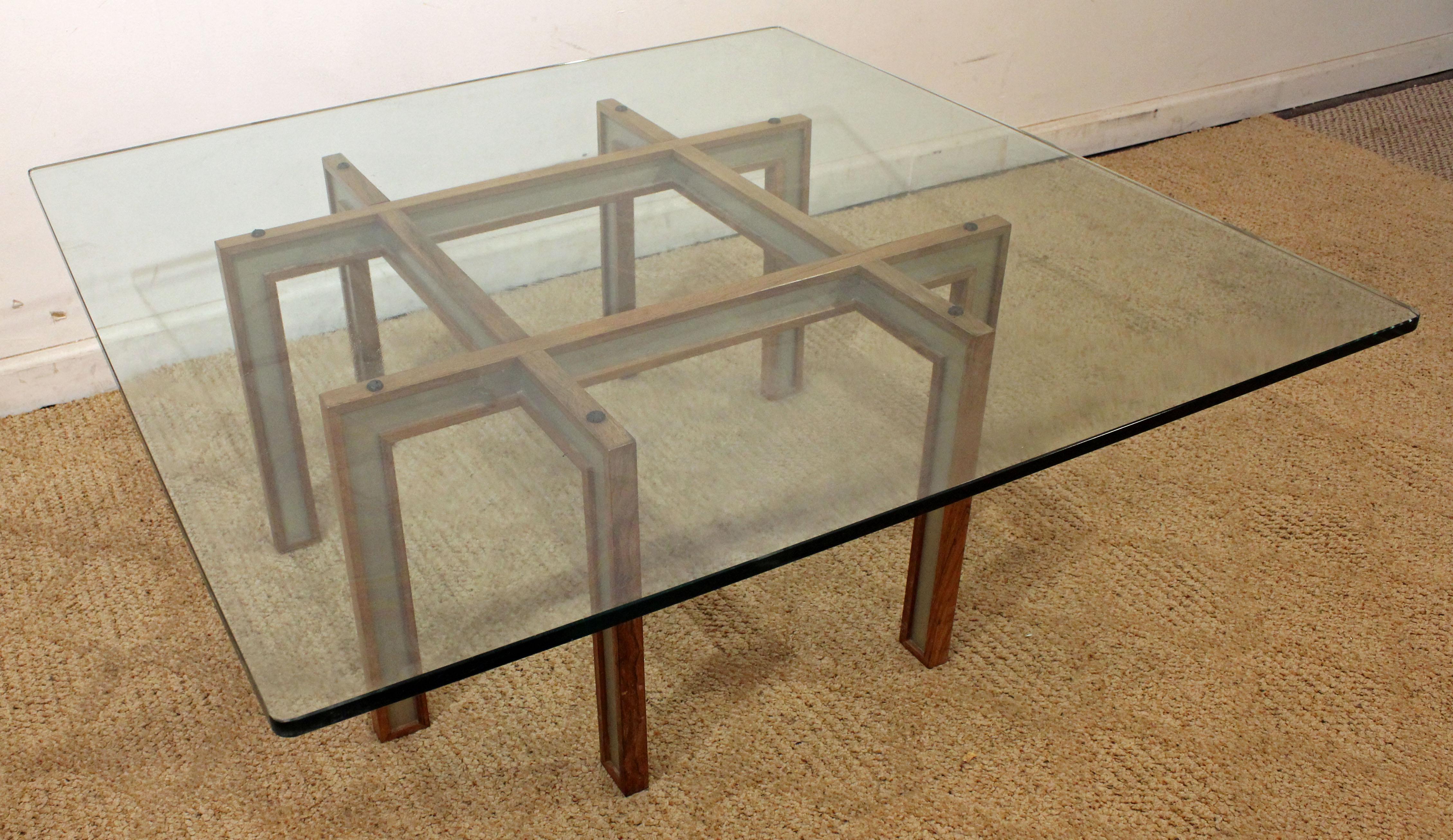 Offered is a very unique Mid-Century Modern coffee table. It has a wooden or aluminium base with a glass top. The table is in great condition, shows minor age wear. It is not marked.

Dimension:
42