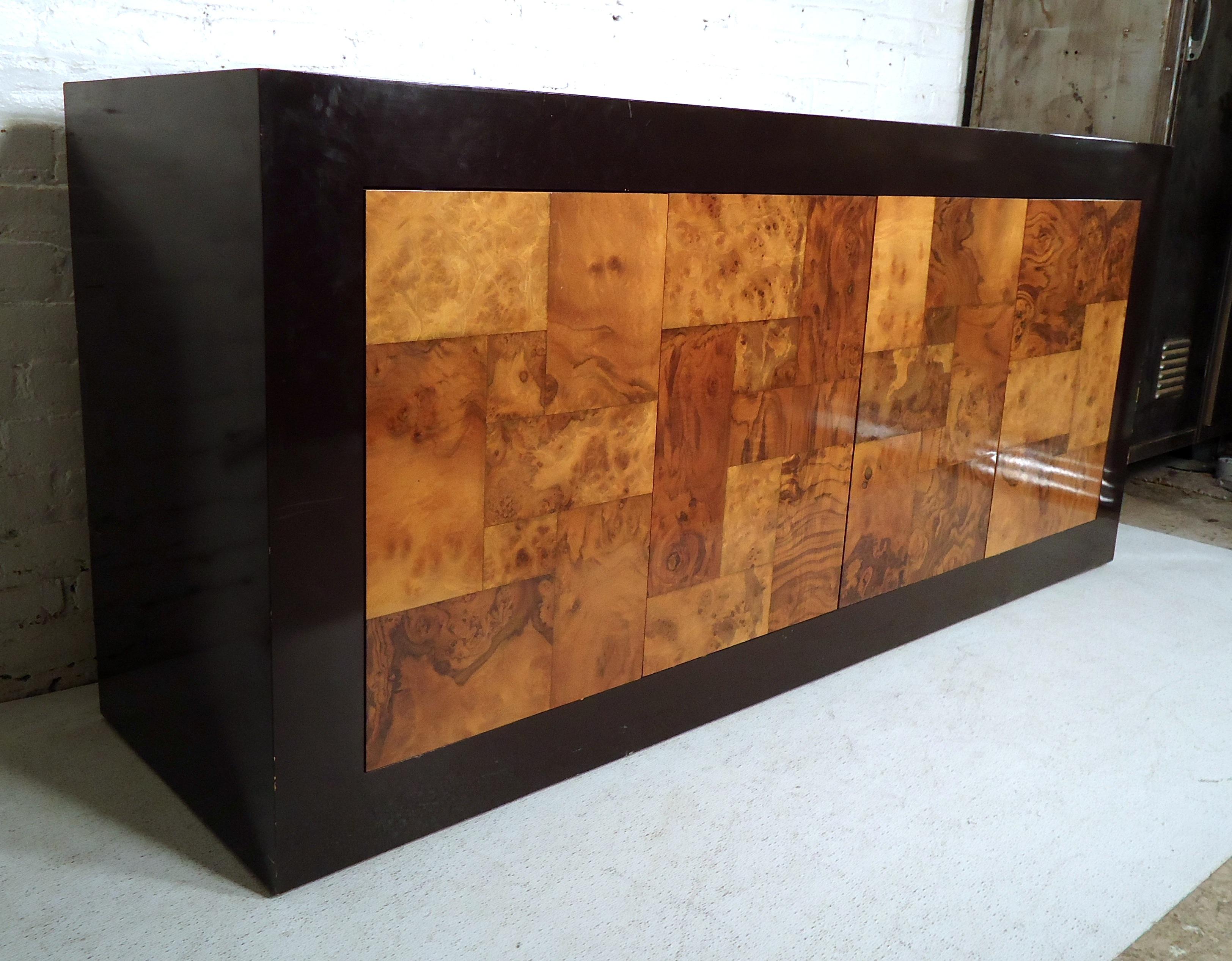 Sleek vintage modern credenza features spacious storage cabinets, small drawer, black lacquer body and burl wood doors. 

Please confirm item location (NY or NJ).