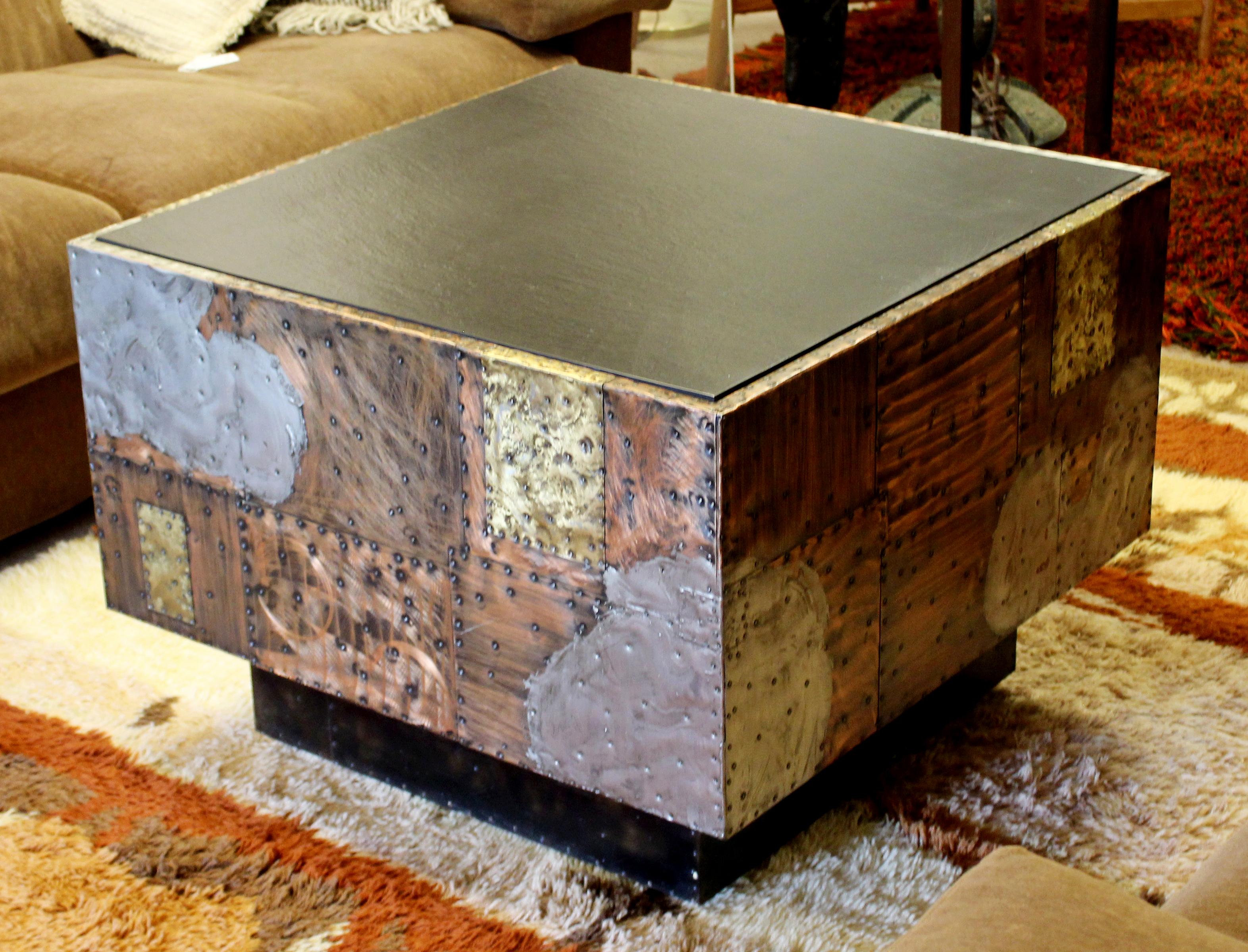 For your consideration is an incredible, cube coffee table, with a removable slate top on patchwork copper sides, by Paul Evans, circa the 1970s. In excellent vintage condition. The dimensions are 29.5