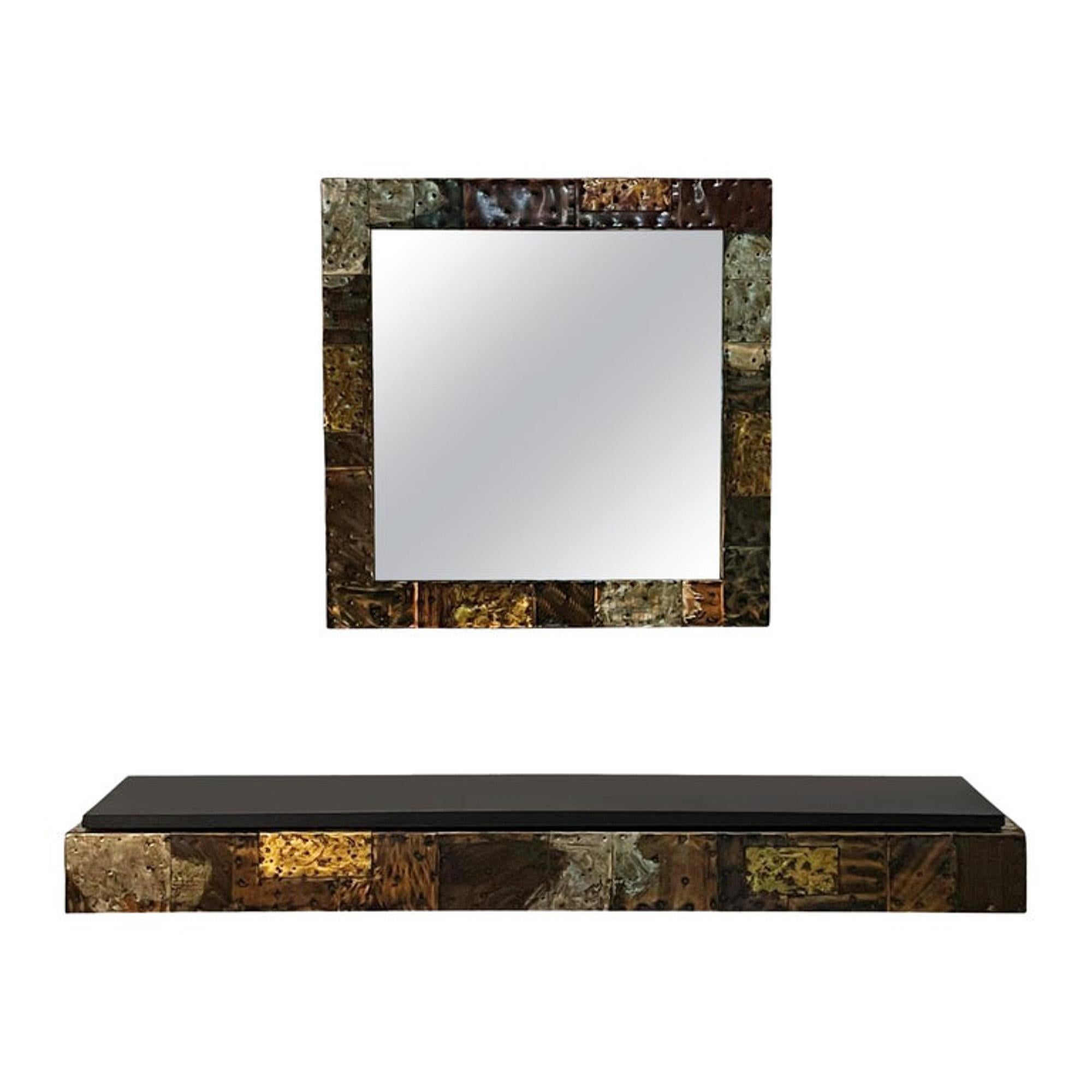 Paul Evans studio floating shelf and mirror set circa early 1970's. It features copper, bronze and pewter cladding in a patchwork design. Console shelf measures 60 x 13 x 6.5 inches with heavy black slate top. Mirror measures 30 inches. All in very