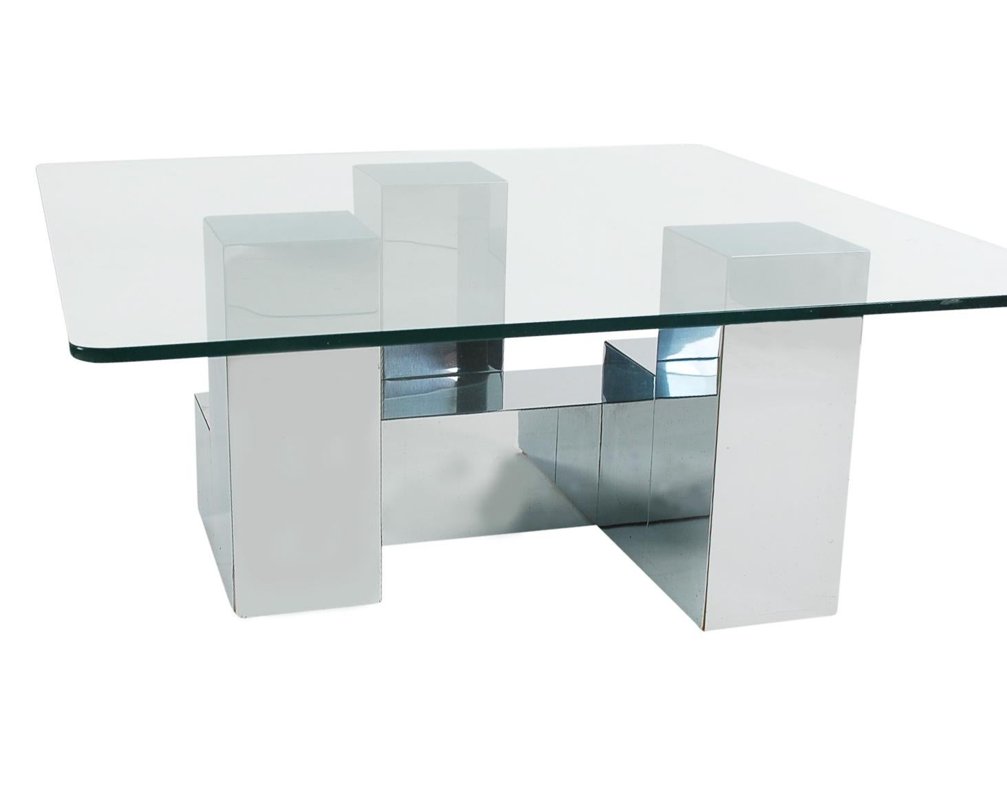 A stunning cityscape design coffee table in the manner of Paul Evans. It features a chrome-plated wood constructed base, topped with thick clear glass top.