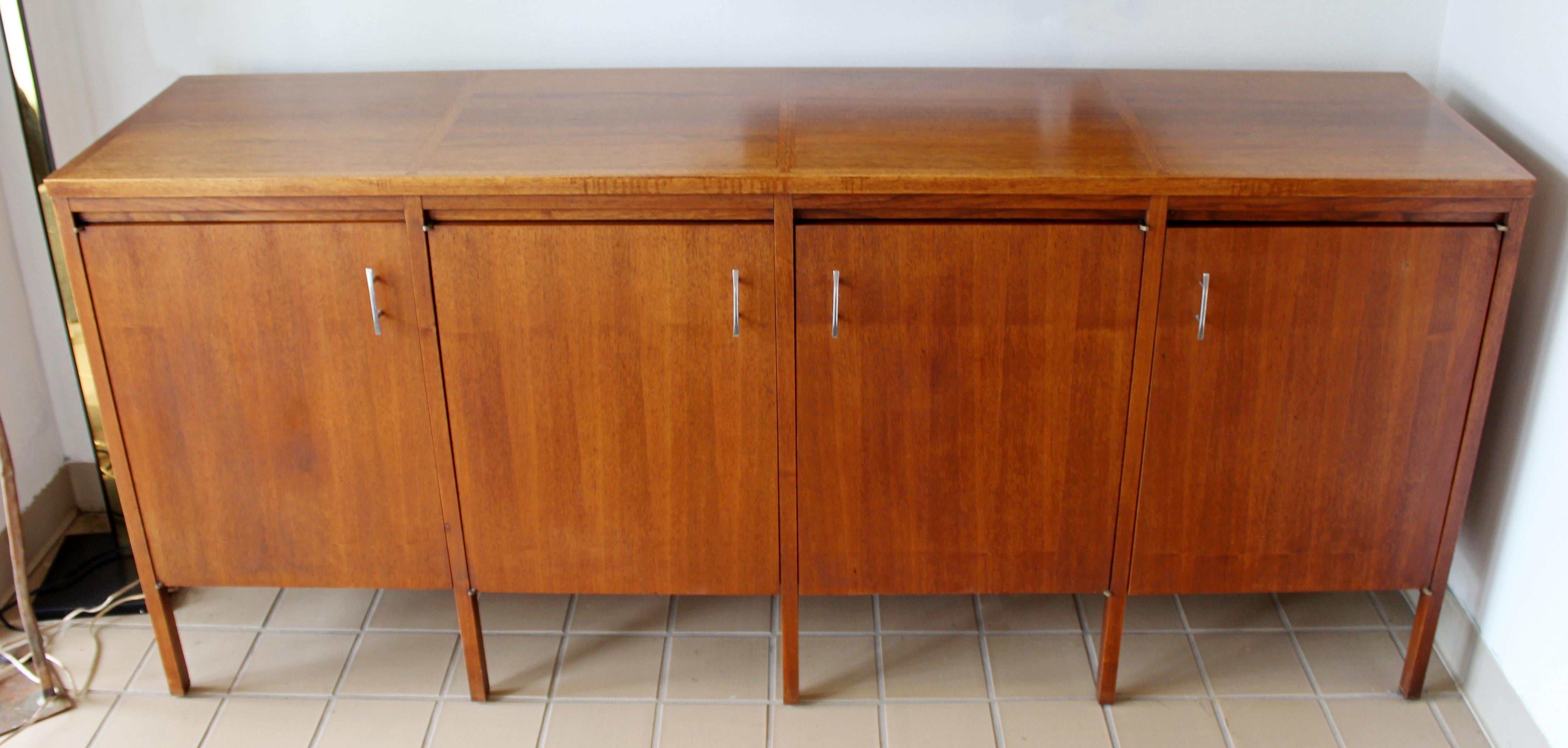 For your consideration is a marvelous, walnut credenza, with four doors and shelves and two drawers, by Paul Mccobb for Lane Altavista, circa the 1960s. In very good vintage condition. The dimensions are 72