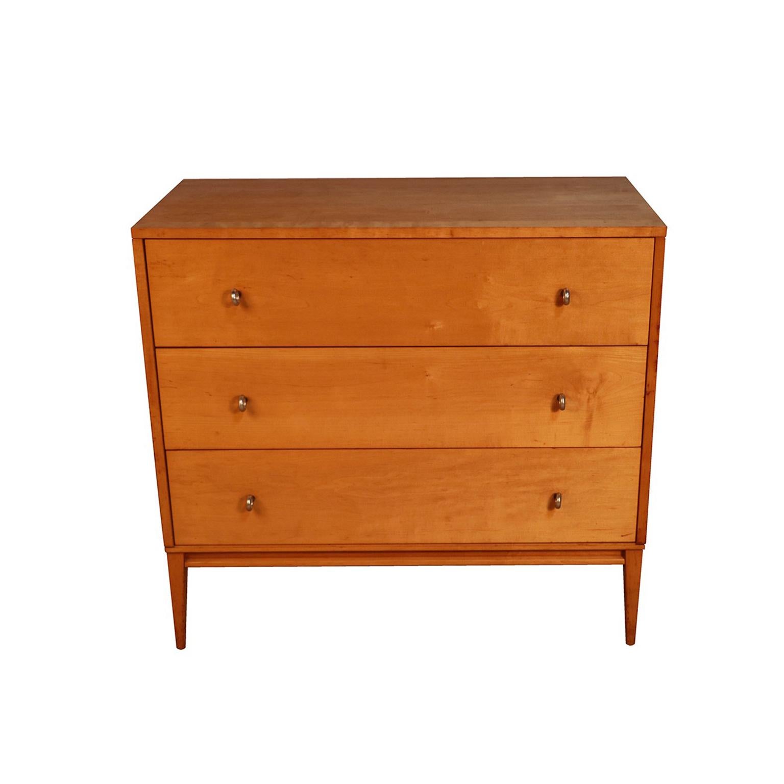 Handsome, Classic Mid-Century Modern three drawer dresser, chest by Paul McCobb for his Pre-Planner Group Winchendon modern line made by Winchendon Furniture in the 1950s. Features three spacious, deep drawers, with original signature aluminum ring