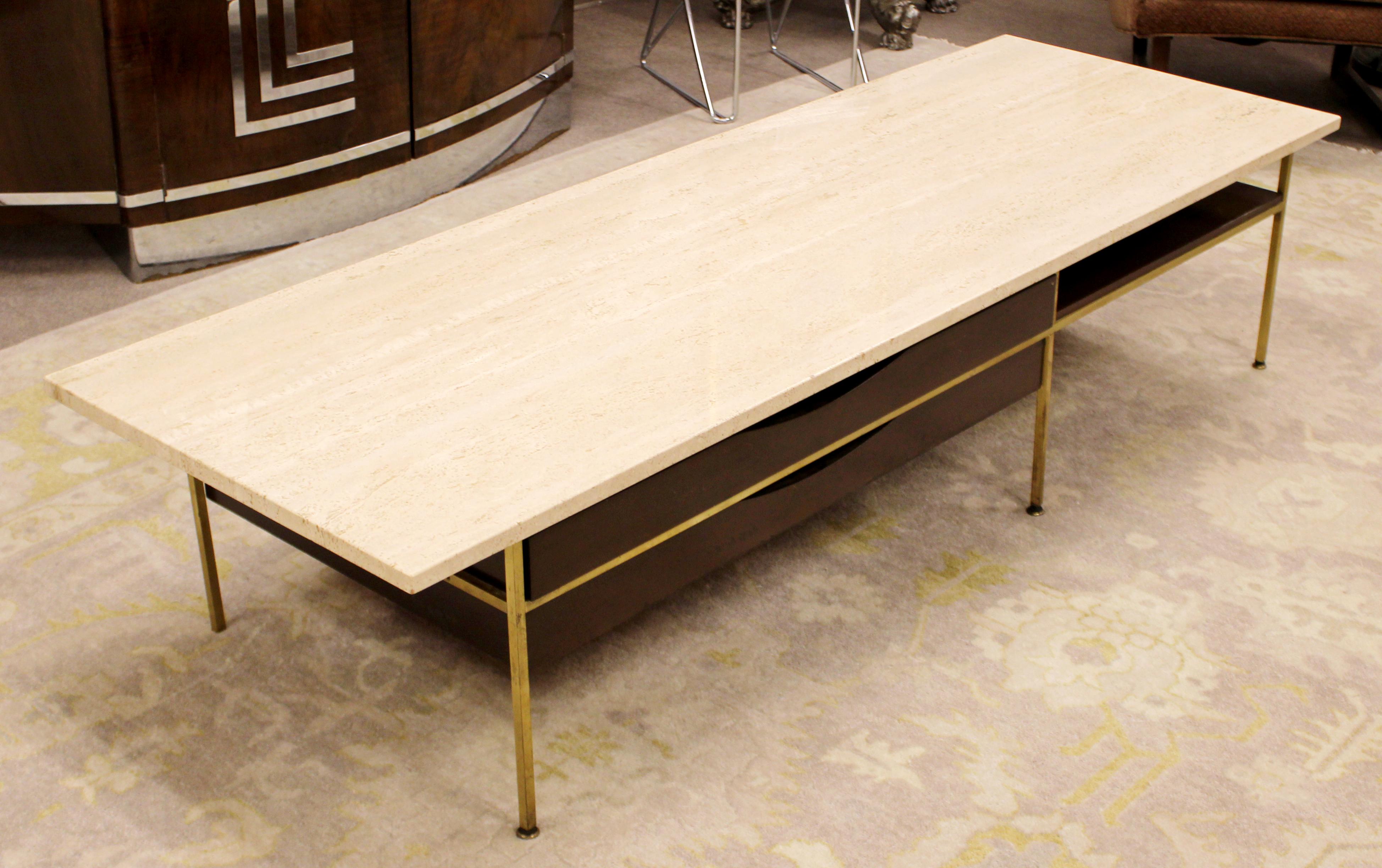 For your consideration is a striking, Travertine topped coffee table, with a brass and wood base, by Paul McCobb, circa 1960s. In excellent vintage condition. The dimensions are 72
