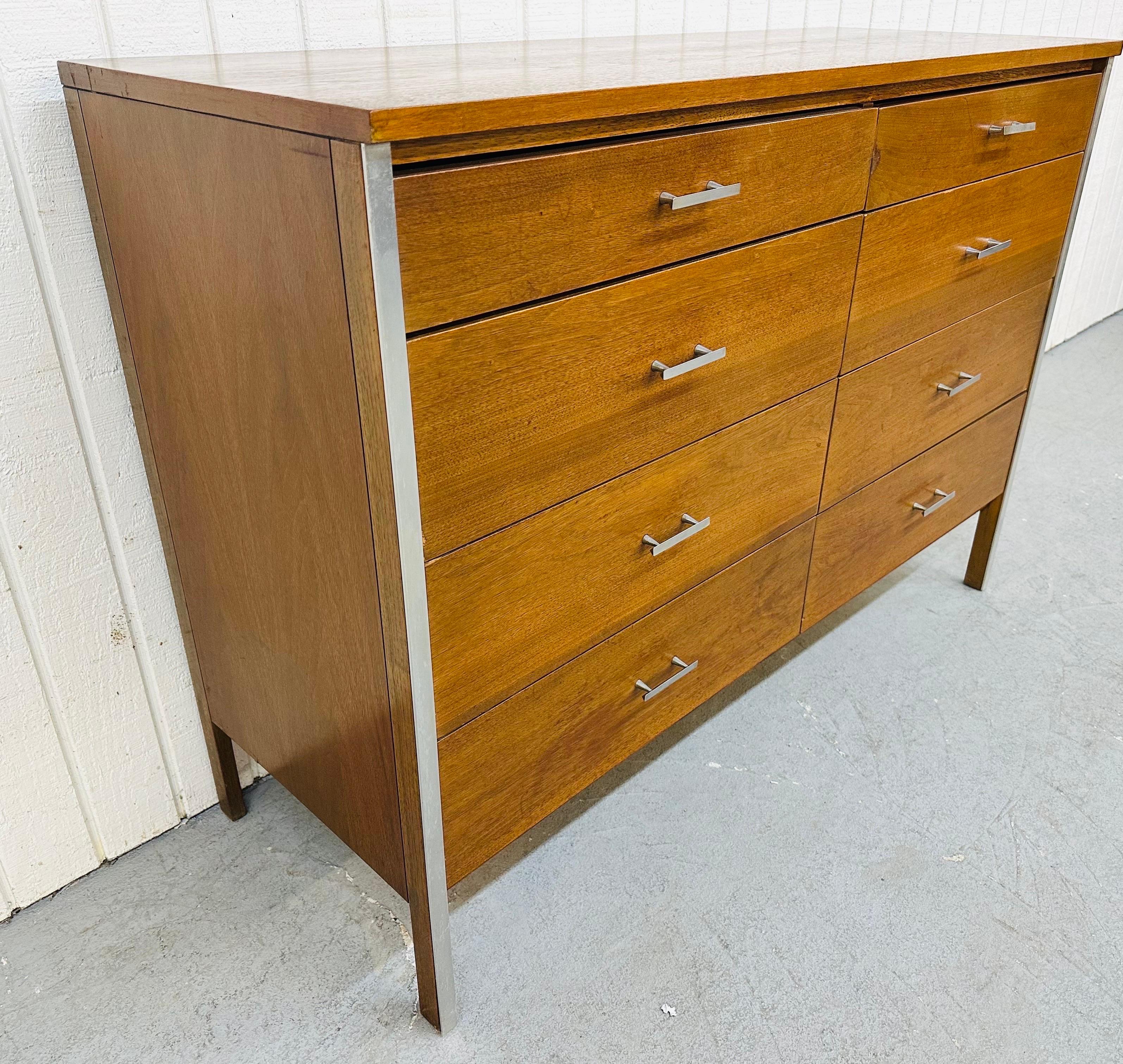 This listing is for a Mid-Century Modern Paul McCobb Walnut 8-Drawer Dresser. Featuring a straight line design, eight drawers for storage, original chrome pulls, and chrome accent on the legs. This is an exceptional combination of quality and design!