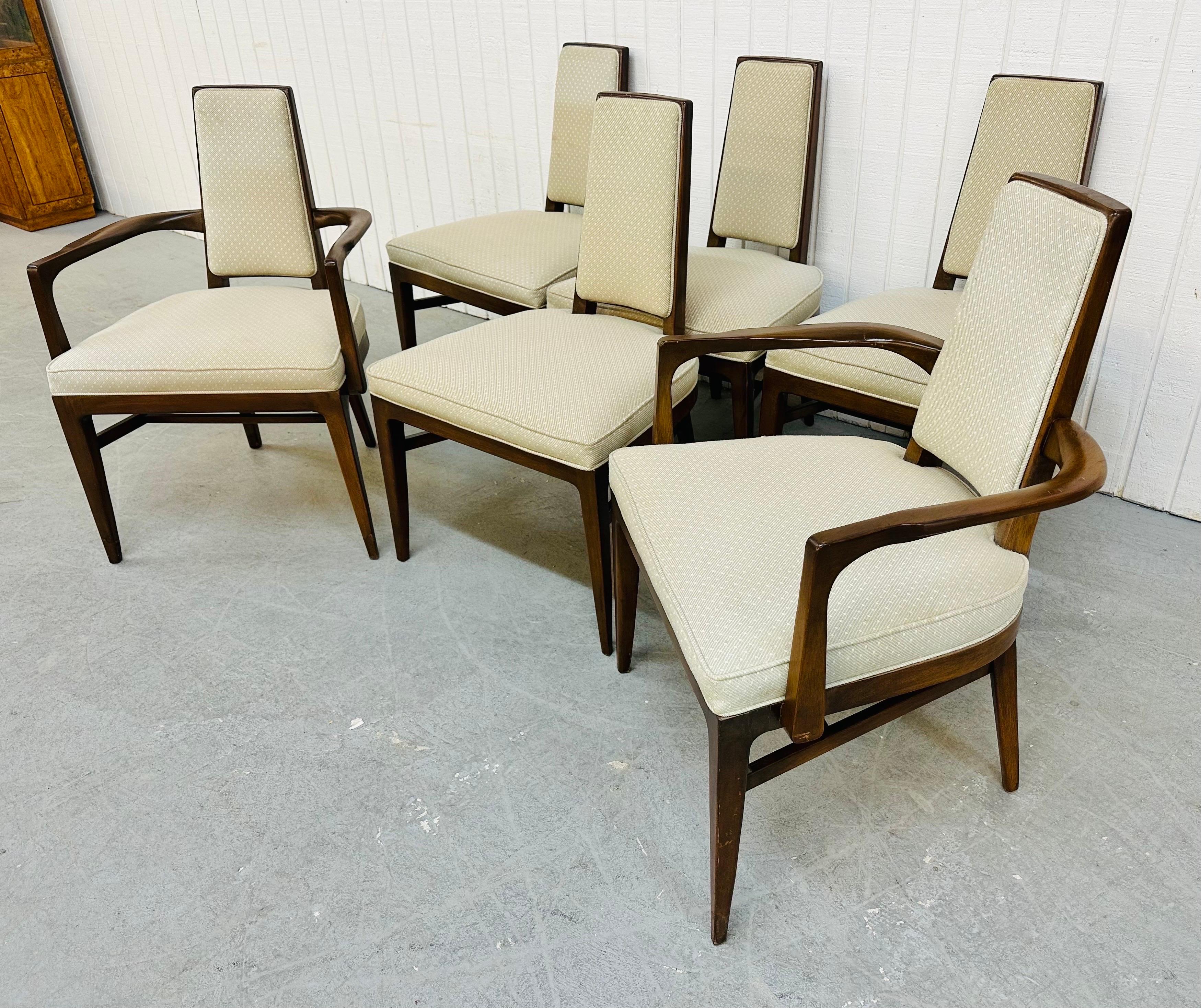 This listing is for a set of six Mid-Century Modern Walnut Dining Chairs. Featuring two arm chairs, four straight chairs, walnut frames, light gray upholstery, and tall skinny Adrian Pearsall style back rests. This is an exceptional combination of