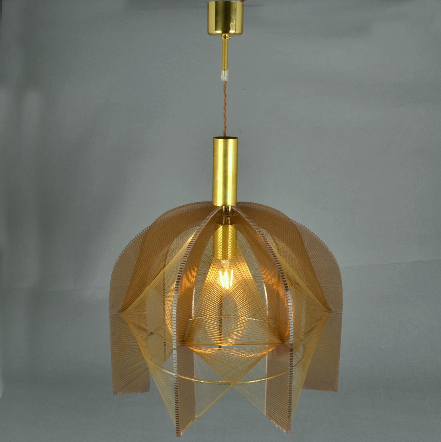 Sculptural lamp made of bronze perspex and clear transparent wire accompanied brass internal fittings holder and nickel ring. The design is influenced by the pioneer, Avant Garde artist and sculptor Naum Gabo (1890–1977). 
These lamps are monumental