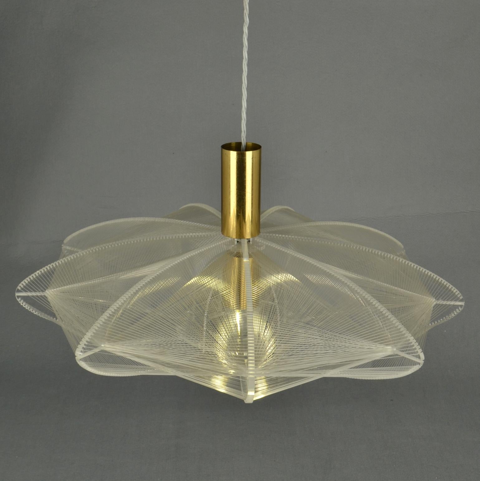 Sculptural lamp in flat formation of clear acrylic / Perspex and clear transparent wire accompanied brass internal fittings holder. The design is influenced by the pioneer, Avant Garde artist and sculptor Naum Gabo (1890–1977). 
These lamps are