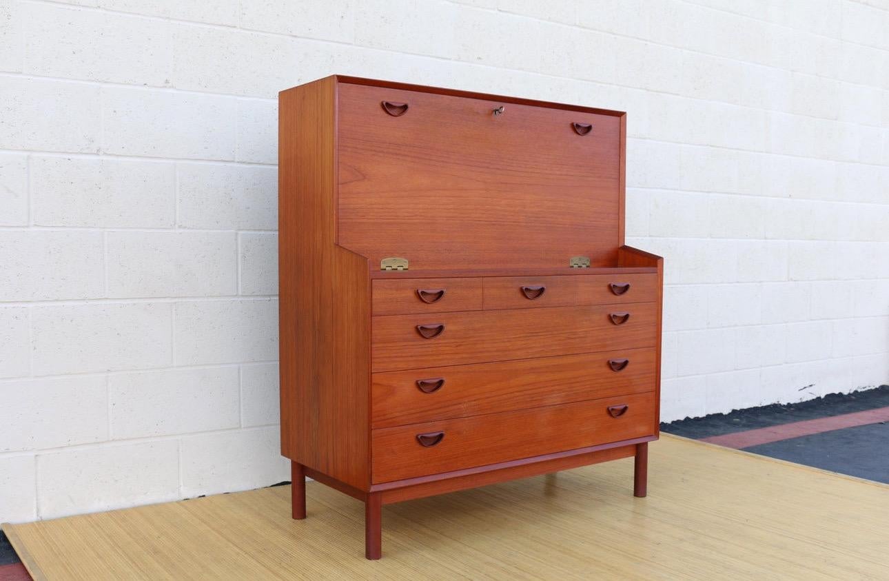 Wonderful secretary desk designed by Peter Hvidt and Orla Mølgaard-Nielsen for Søborg Møbler. It has the label in the back. This secretary desk is made in Denmark. It is in vintage condition and has some minor scratches. Also, it has a damage in the