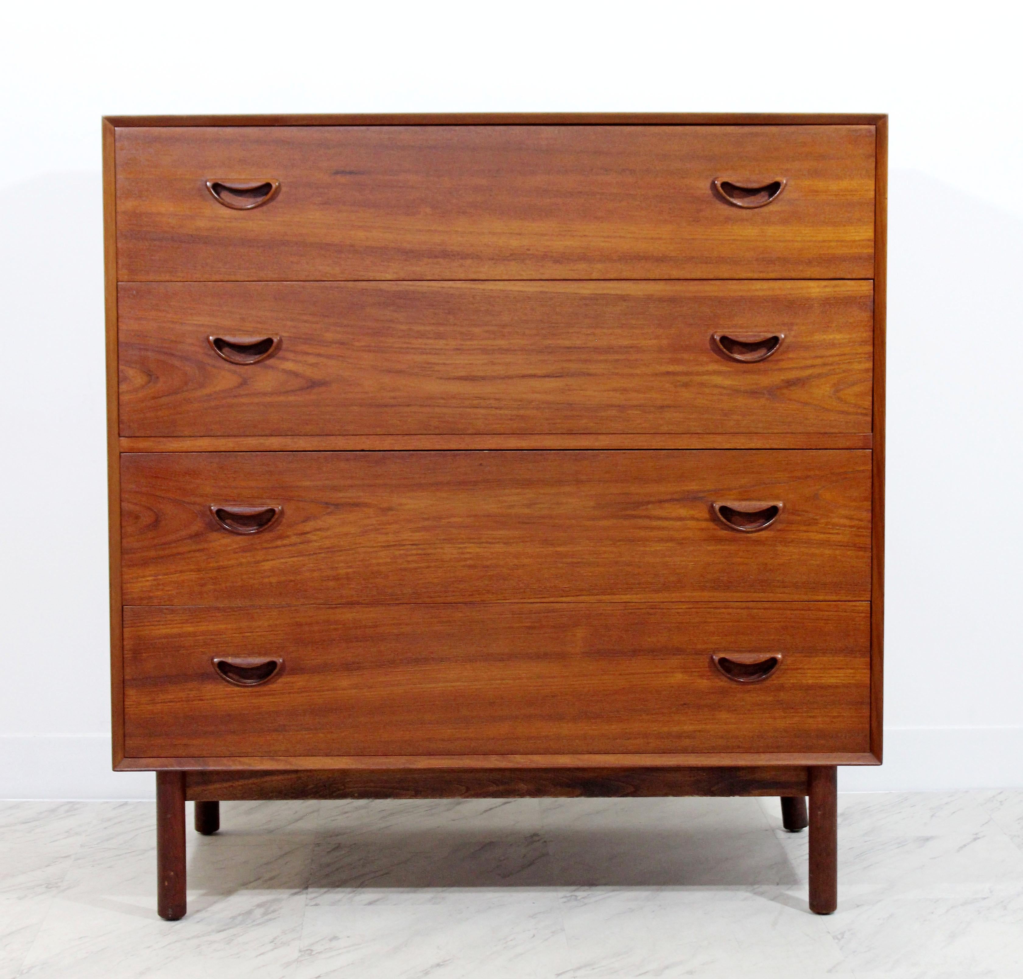 For your consideration is an immaculate, four-drawer, teak dresser vanity or gentleman chest, with six small compartments in the top drawer, circa the 1950s. Designed by Peter Hvidt & Orla Molgaard Nielsen. In excellent condition. The dimensions are