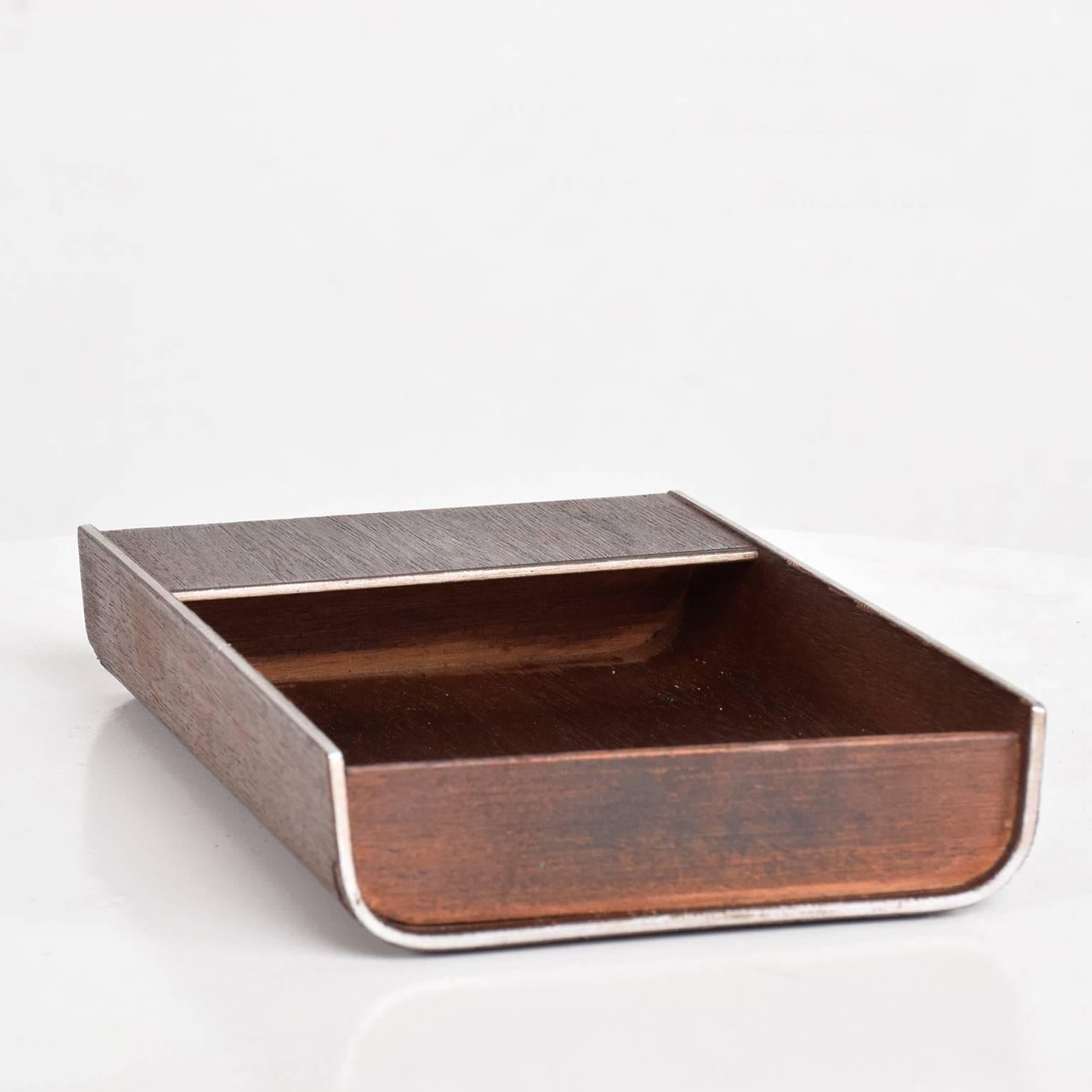 We are please to offer for your consideration a unique desk accessory tray. Constructed with aluminum frame with walnut veneer and solid walnut sections. Retains original label from the maker underneath. 
A must have item. 

Dimensions:
1 3/8