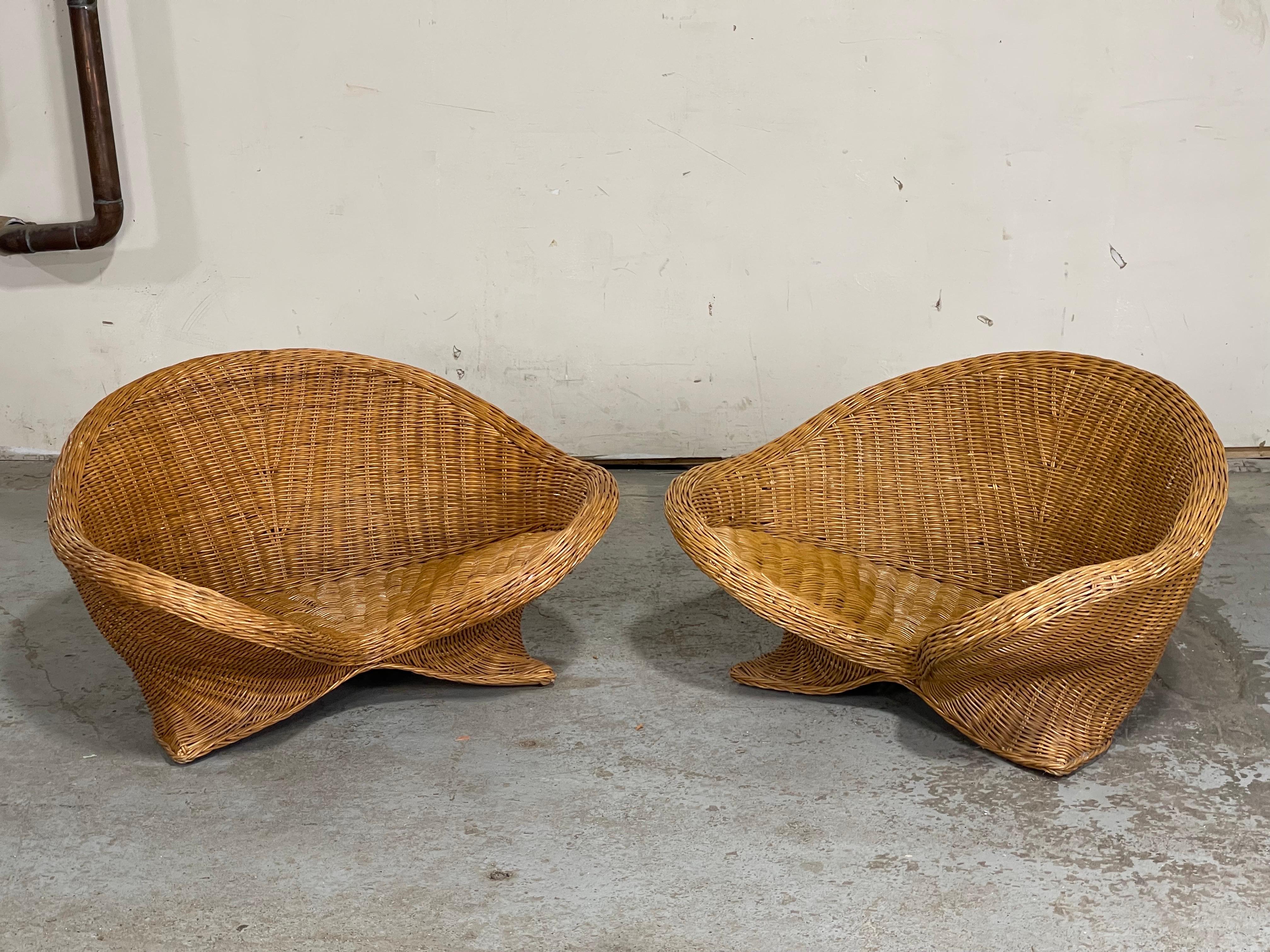 Scarce petite lotus style rattan chairs by Vivai Del Sud, Italy, 1970’s. 
The Vivai del Sud Architecture and High Decoration Group was founded in Rome in 1950. They were a leader in the production of high end furnishings and accessories for