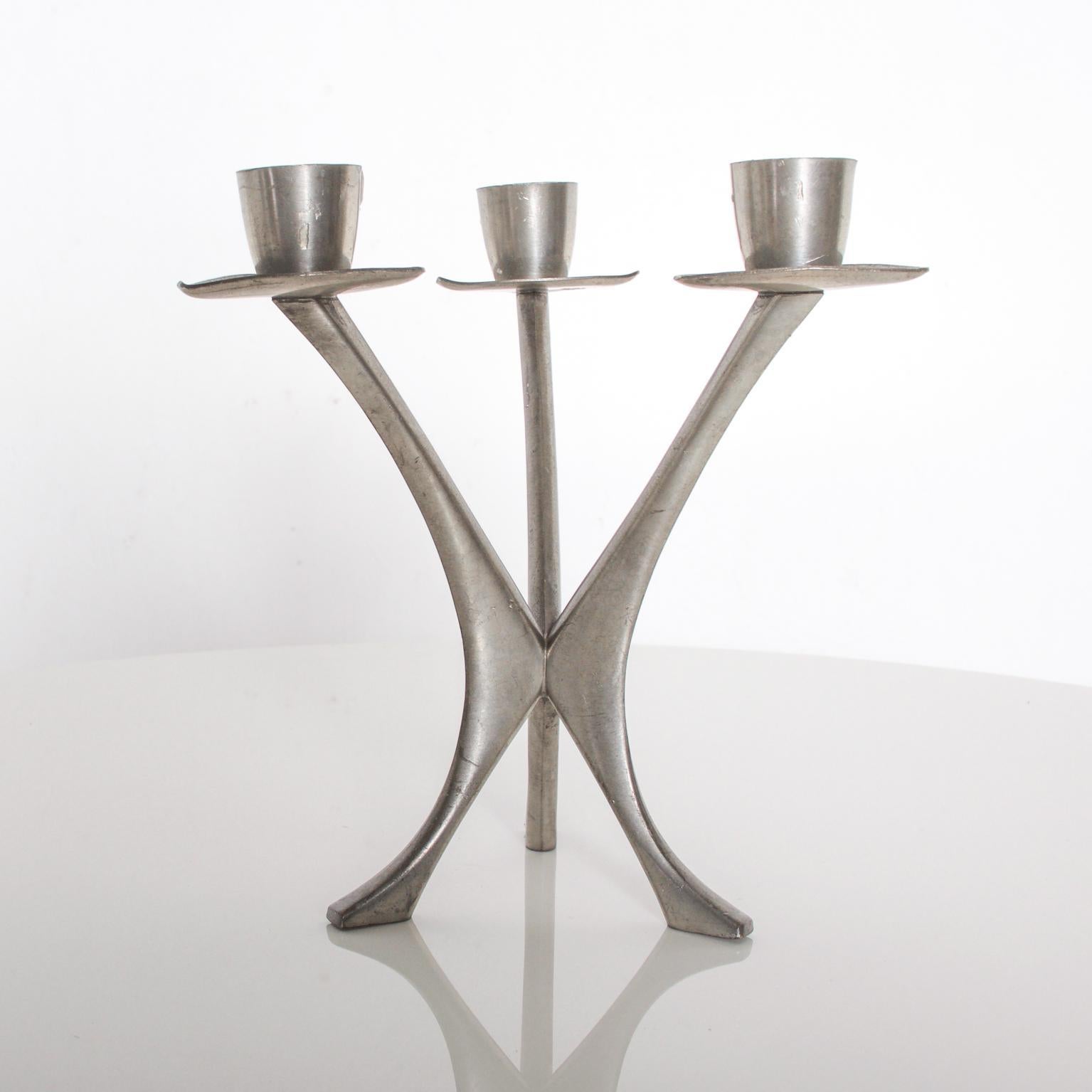 For your pleasure: Midcentury candleholder Three candle candelabra in Pewter from Norway. 
Norwegian Brodrene Mylius Pewter, BM Pewter, stamped by maker. 
Dimensions: 6 1/2