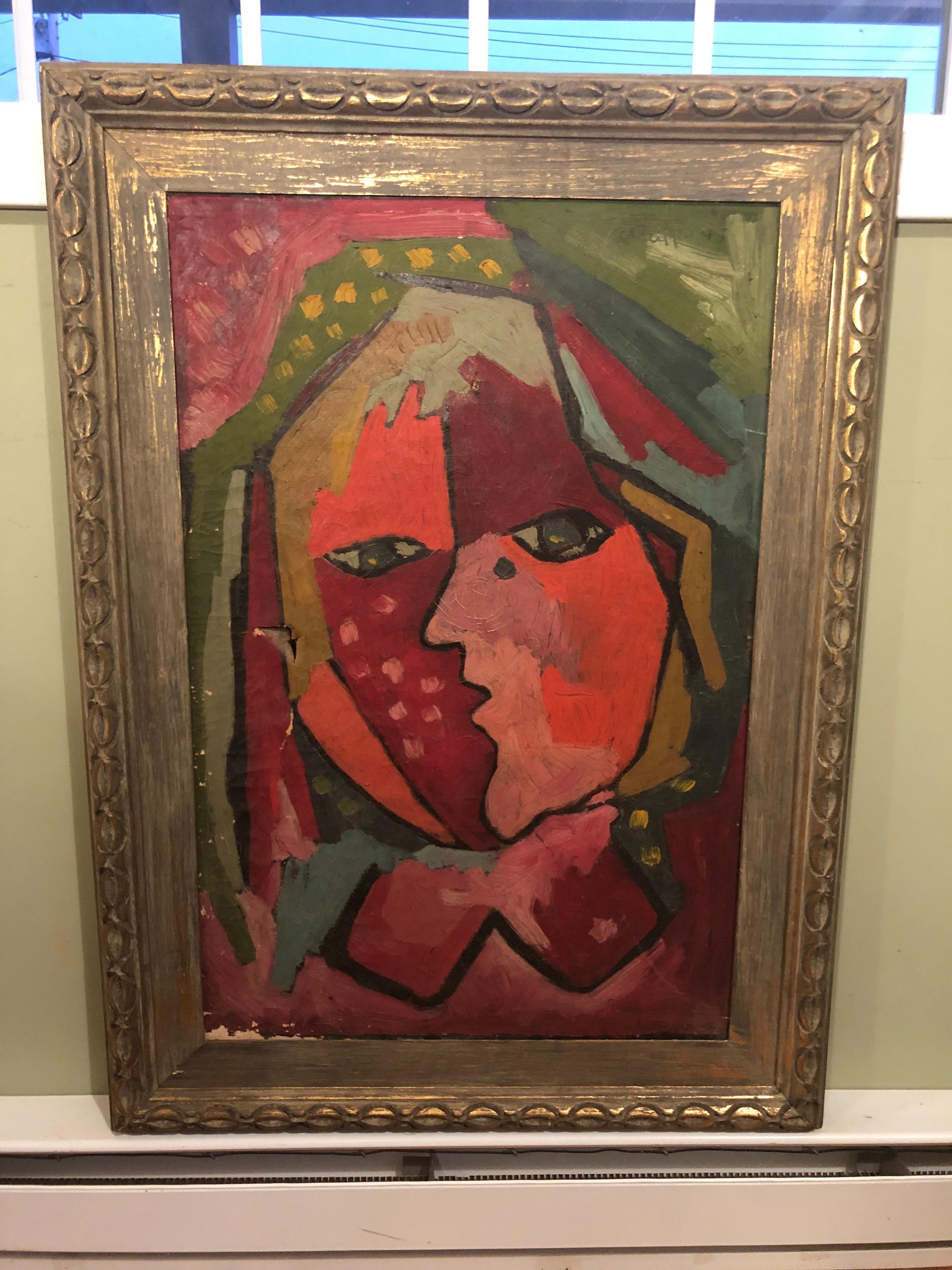 Mid Century Modern Picasso style Abstract of a face by E.Ruff 1945.
Amazing composition and color. Nice gilt frame. One small tear can be repaired.
