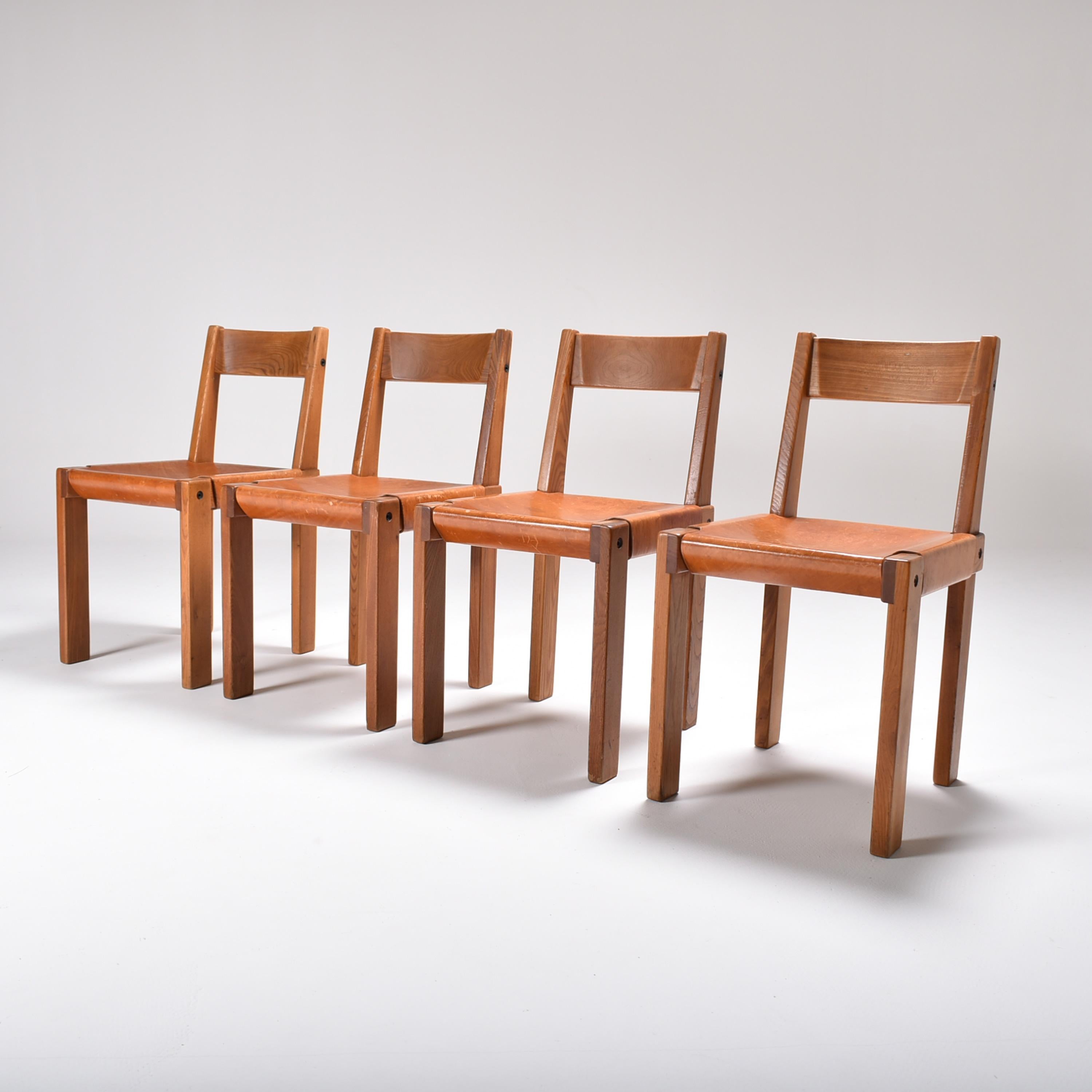 Set of four Mid-Century Modern Pierre Chapo dining room chairs, in solid elm and cognac leather.
Made of solid elm, Chapo's favorite wood specie, with his typical attention to details and finish.
The cognac leather is thick with a nice patina,