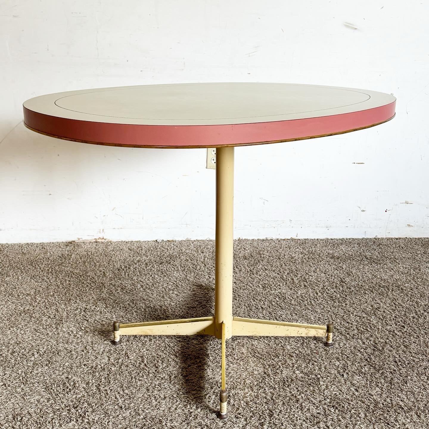 Embrace the retro allure with this Mid Century Modern Oval Dining Table, featuring a pink and white laminate top. Its distinctive oval shape and sleek, tapered legs capture the essence of mid-century aesthetics, making it a vibrant centerpiece for