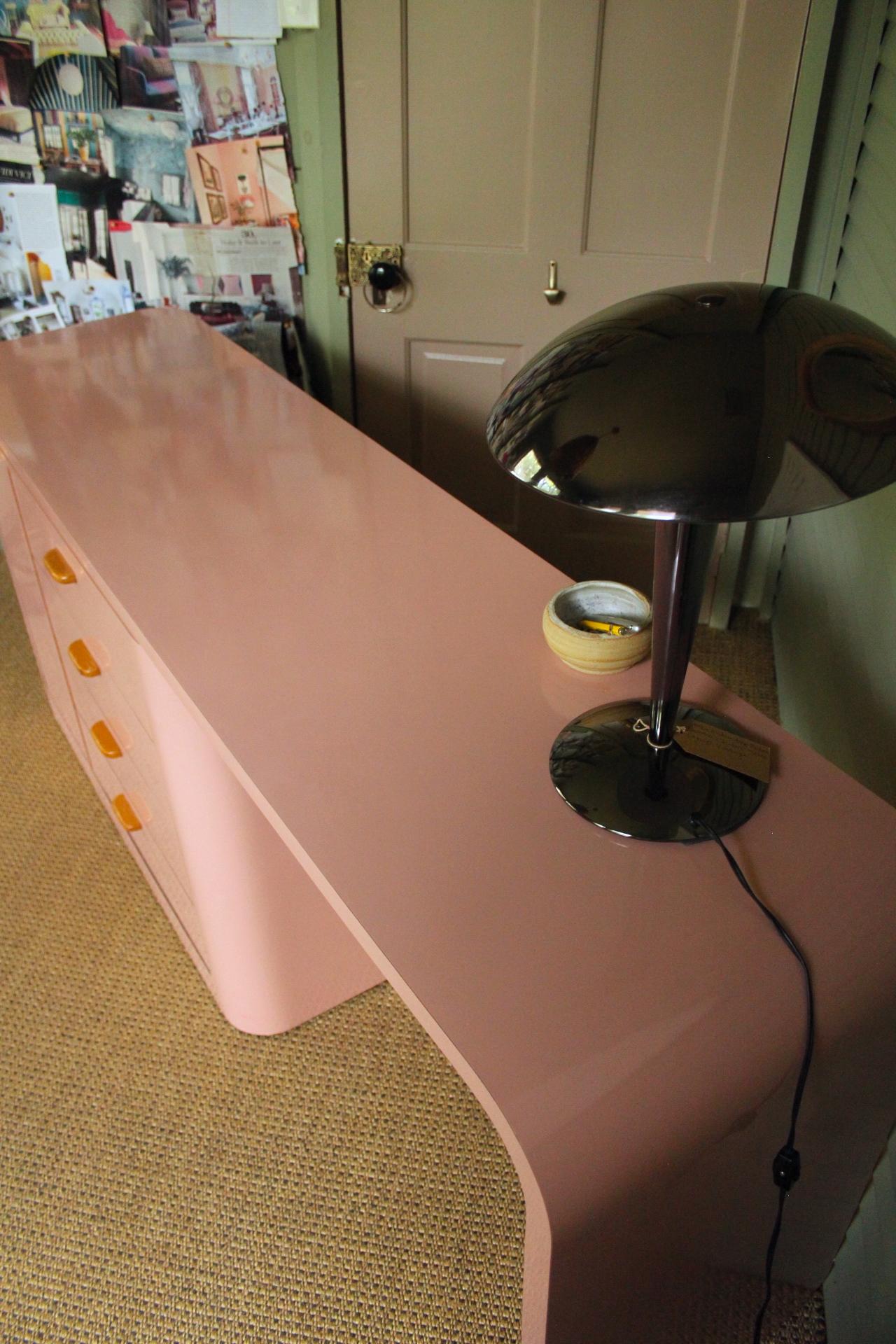North American Mid-Century Modern  Pink Laminate Shallow Desk with 4 Drawers and Teak Handles