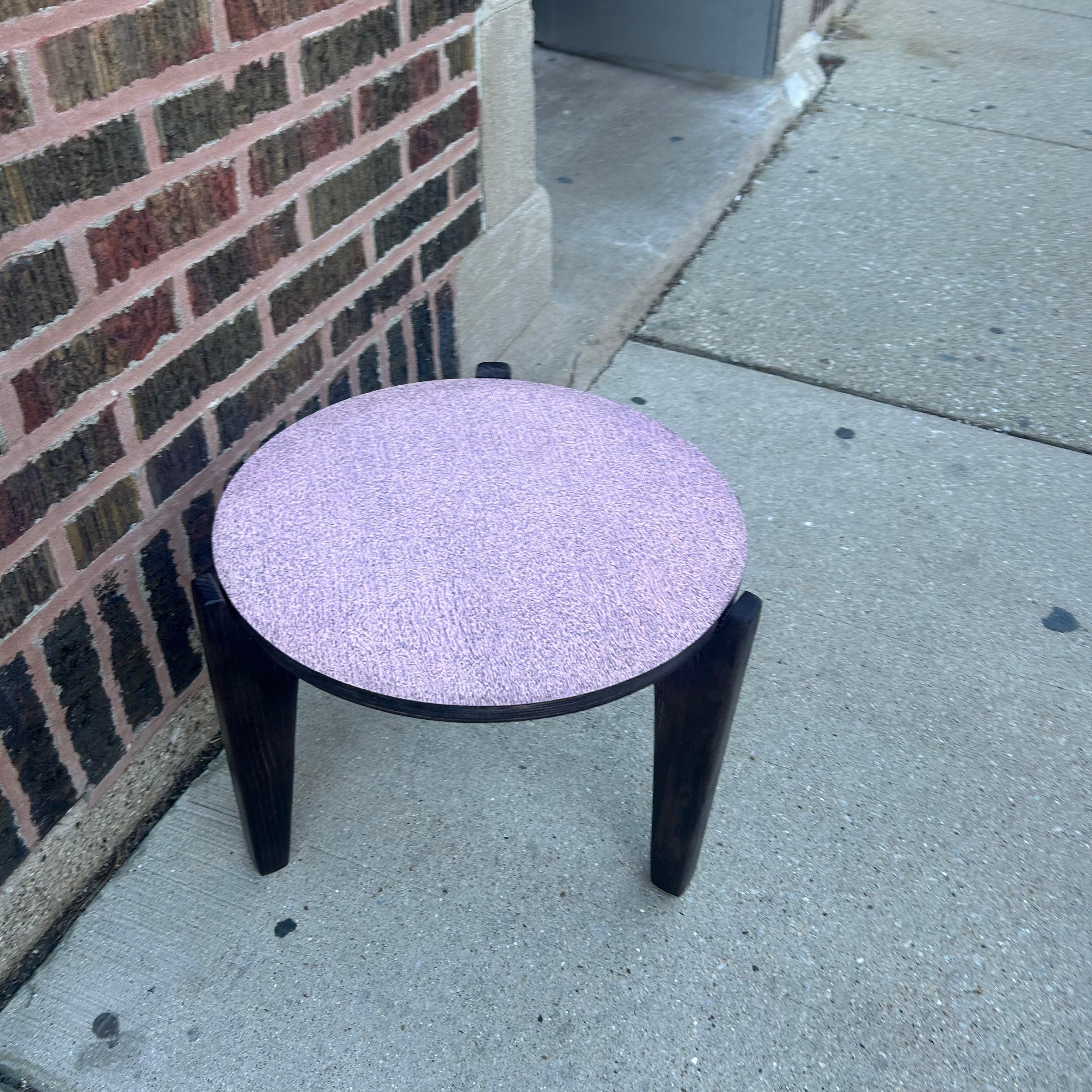 Fabulously vintage -- this pink laminate side table is ready to bring some retro vibes to your space. We love her bubblegum-hued top and MCM-style wooden legs.  The top was cut from a Mid-Century dining table that had suffered some significant