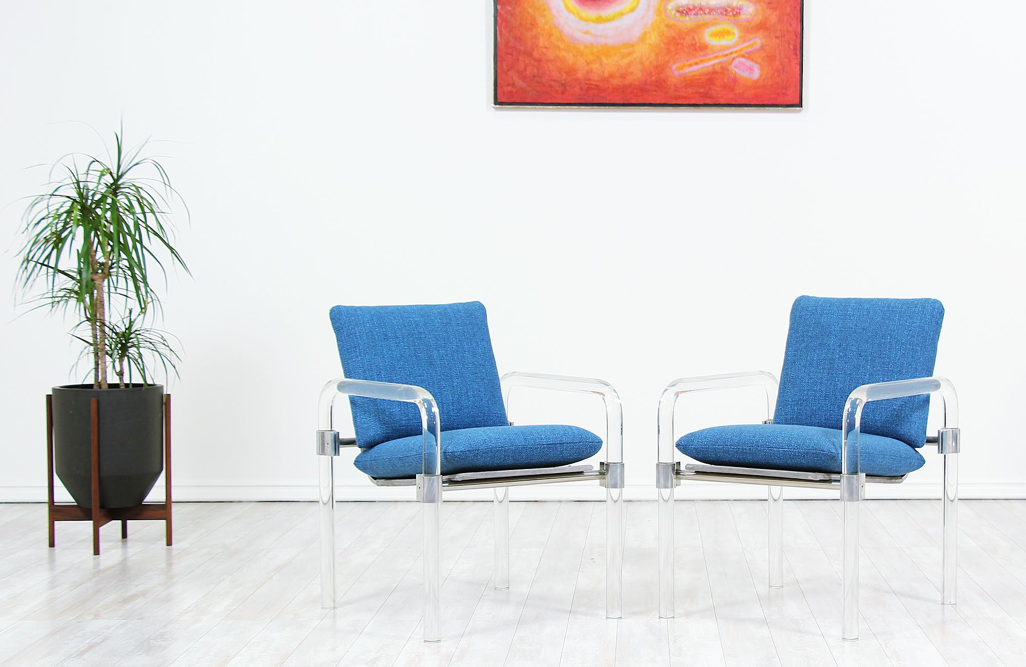 Pair of iconic armchairs designed by Jeff Messerschmidt manufactured by Jeff Messerschmidt Studio in the United States, circa 1980s. This unique design belongs to the Pipeline Series II and features a Lucite frame with steel hardware. The clean,