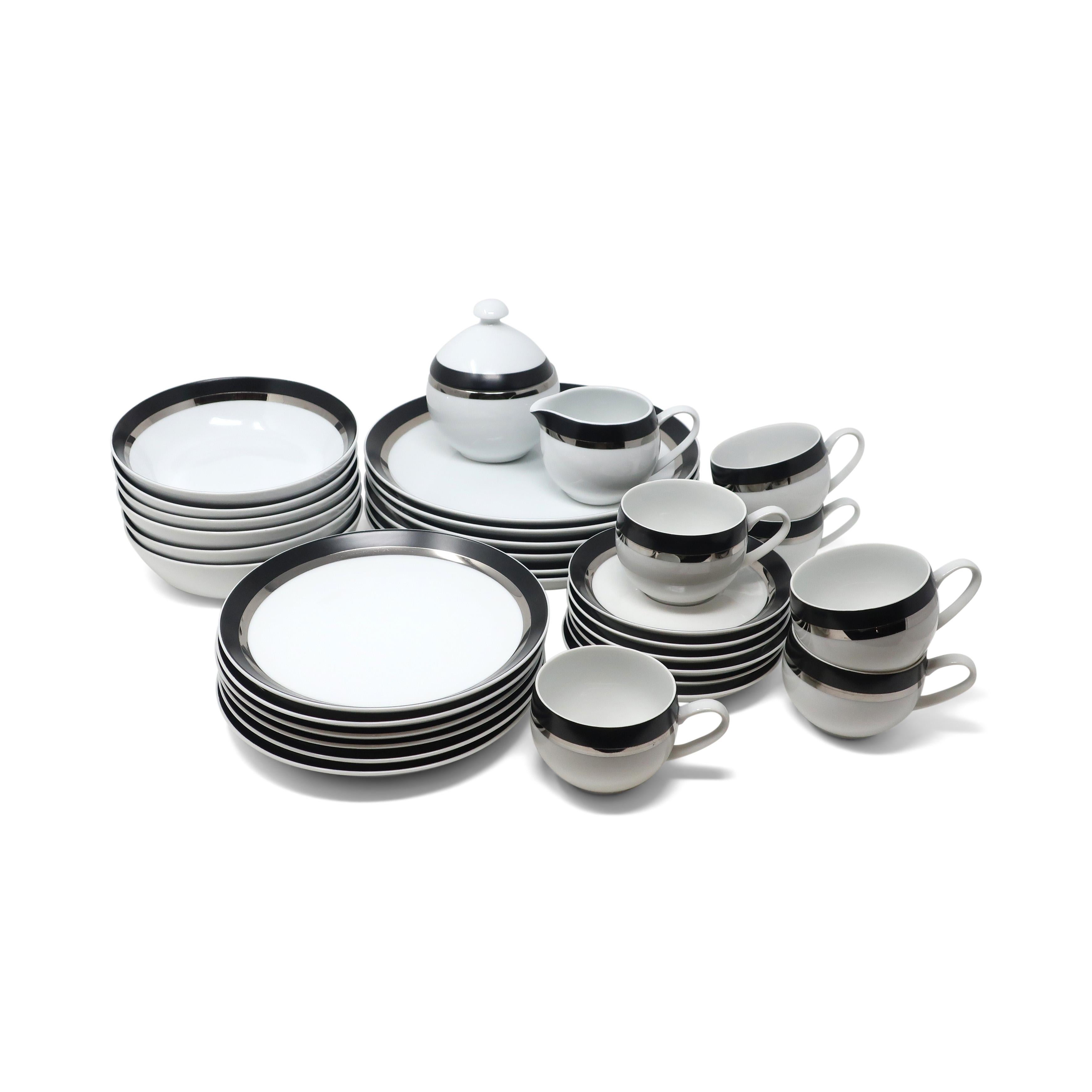 A beautiful set of vintage Ben Seibel's Pivotal dinnerware for Mikasa in the Montina color way. Modern elegance with a clean white glaze and striking black and silver stripes that are great for every day or saving for special occasions. Includes six