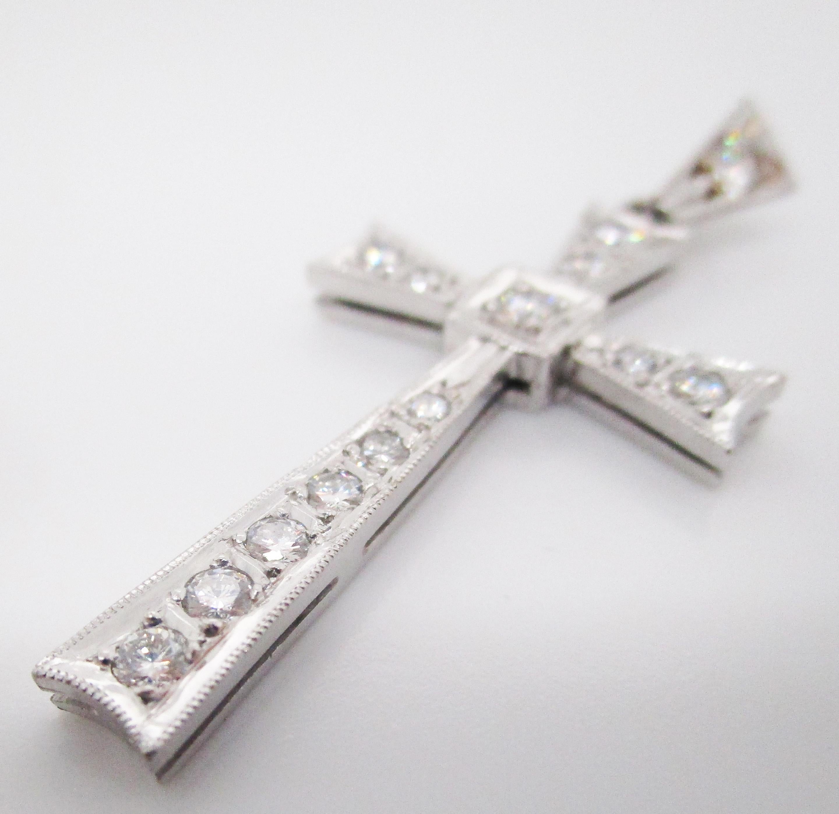 This enchantingly elegant pendant unites bright white platinum with a series of stunningly brilliant white diamonds in a clear mid-century design cross! Every arm of the cross is set with absolutely gorgeous bright white diamonds, completed