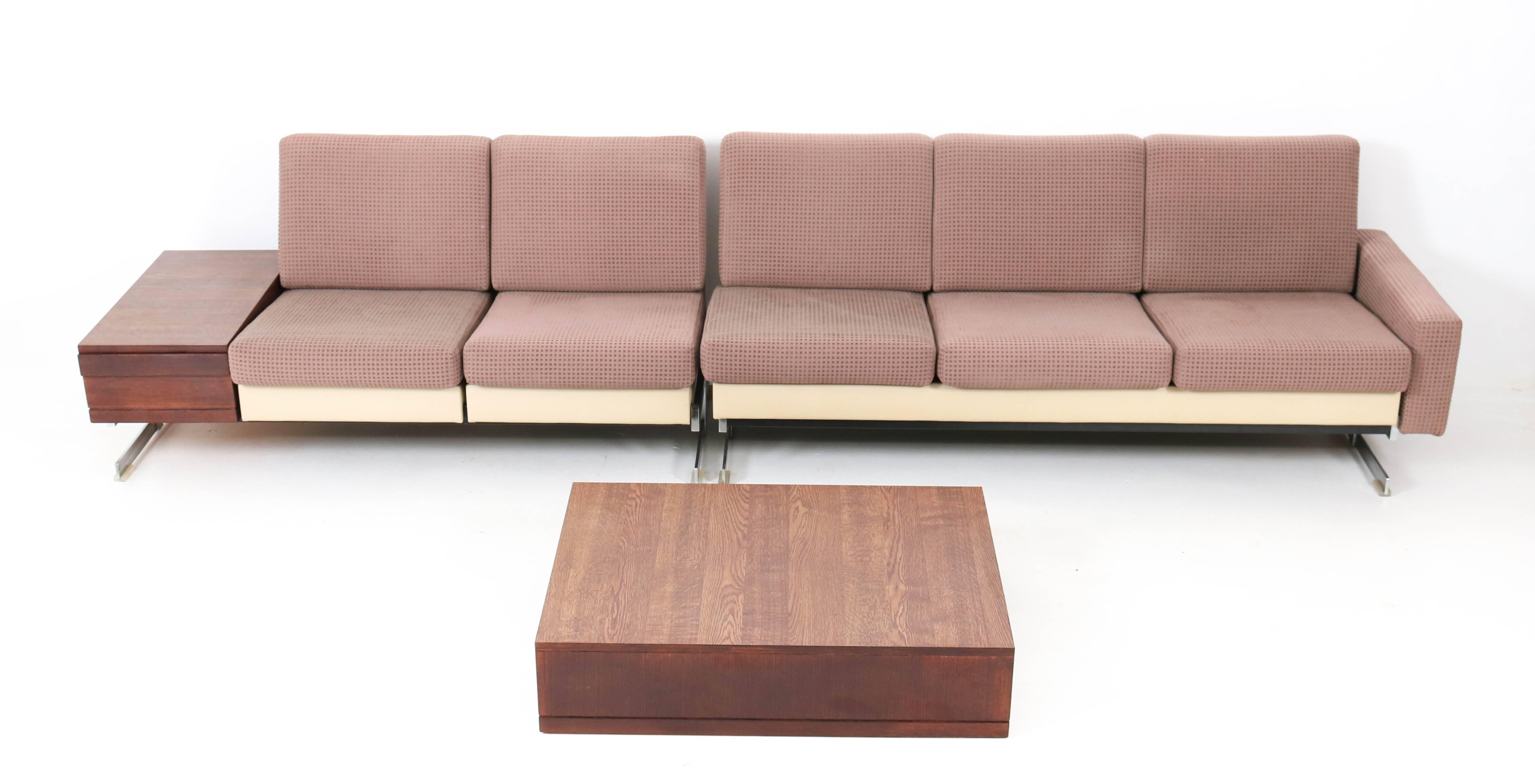 
Rare and hard to find Mid-Century Modern sofas with wenge coffee tables.
Design by Rolf Benz, Model: Pluraform.
Striking German design from the 1960s.
Original chrome-plated metal base and the seats have their original upholstery which is used