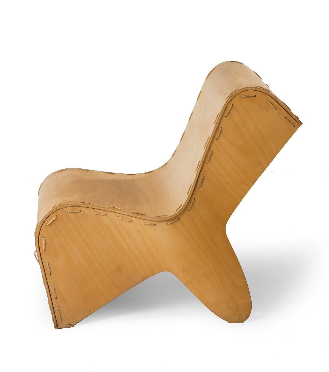Unusual sculptural chair in plywood with the pieces stitched together with rope. This may well be a unique piece, we have as yet, been unable to find a reference as to the Designer. It is clearly vintage as there are signs of usage consistent with