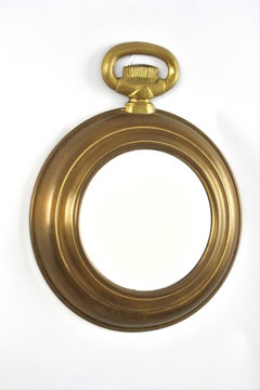 Espejo de pared estilo «Mid-Century Modern» con forma de reloj de bolsillo, de latón, de los años 50