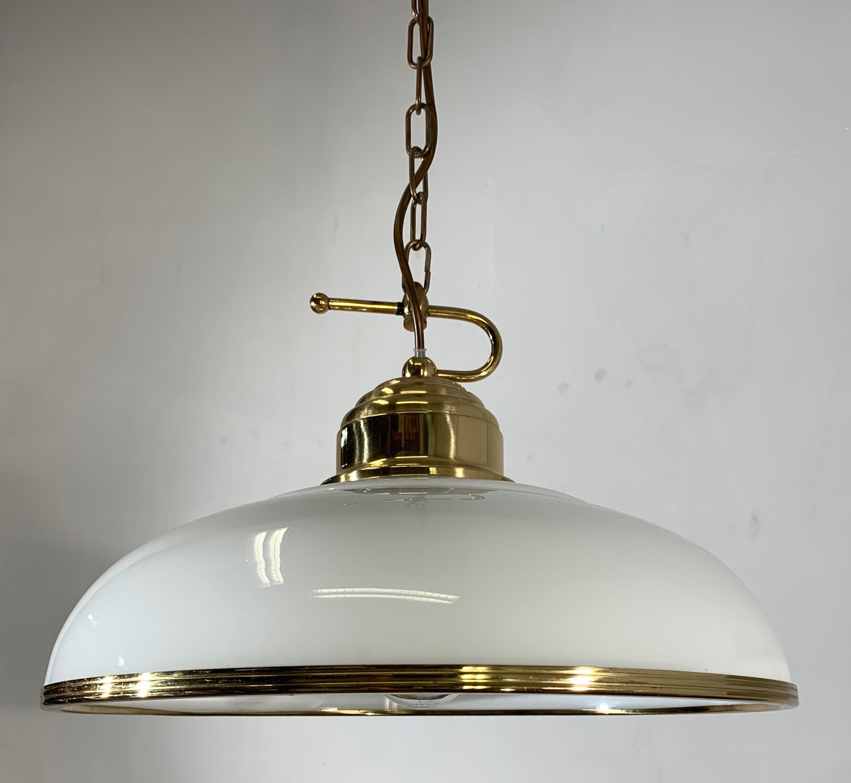 Good size, beautifully designed and excellent quality light fixture.

If you are looking for a midcentury light fixture then this beautiful brass pendant with its clear white opaline shade could be perfect for you. It comes with a solid brass chain