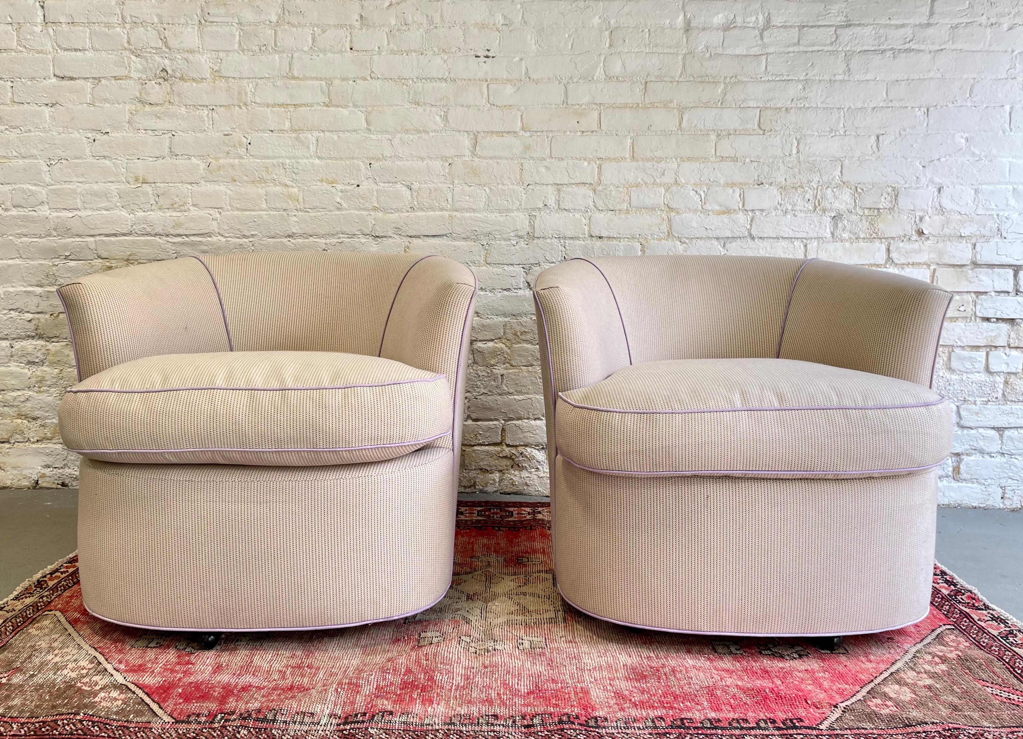 Mid Century Modern / Postmodern Lounge Chairs / club chairs / armchairs in the style of Vladimir Kagan. Smooth and well built swivel mechanism. Lovely cream upholstery with hints of lavender and lime green that add a touch of color to the fabric