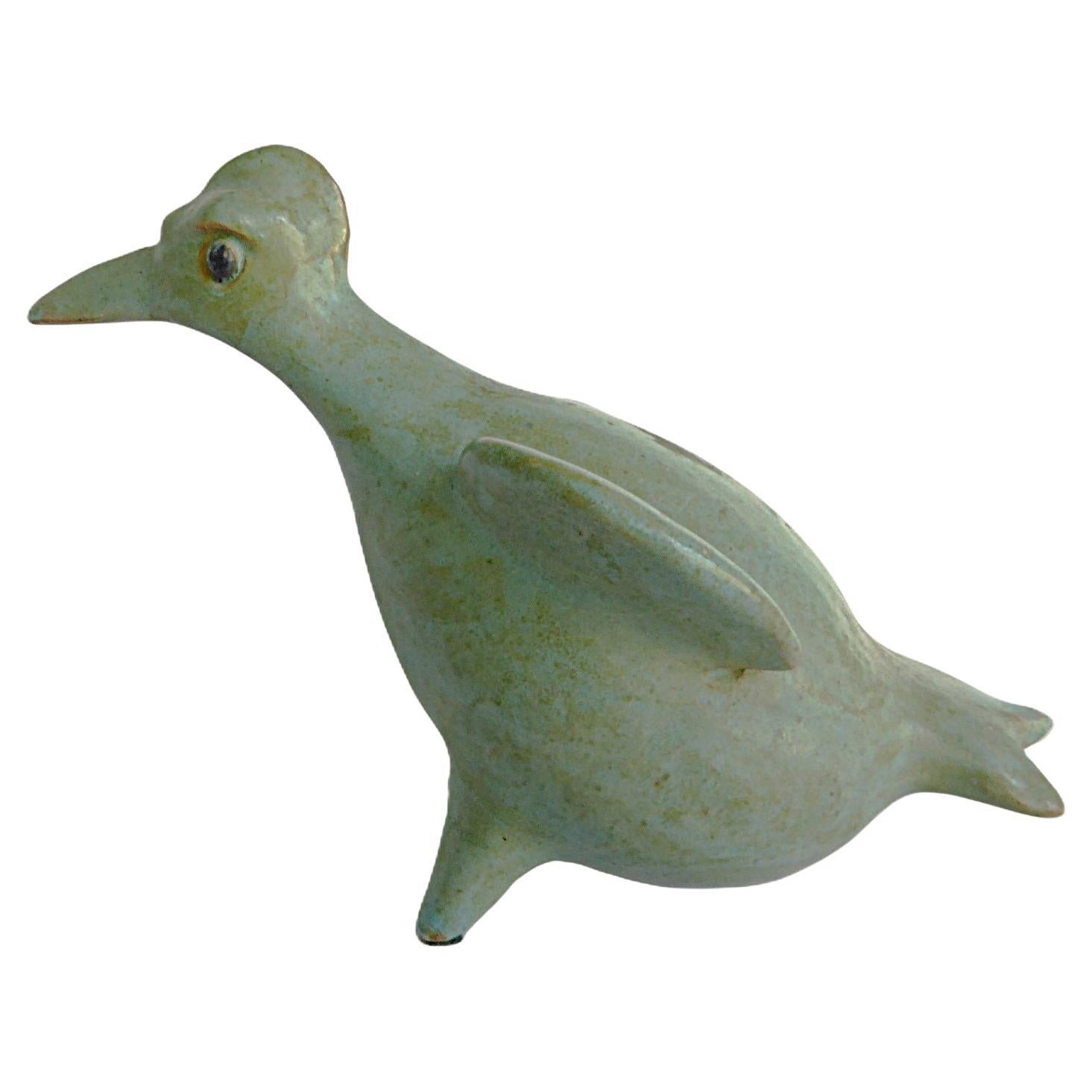  Rustic pottery depiction  of a crested bird by famed Hungarian ceramist Geza Gorka.  Glazed with a muddled blue green satin glazed.  Very good condition with minor wear consistent with age and use.
Measurements: 4 1/2 inches height x 6 1/2 inches