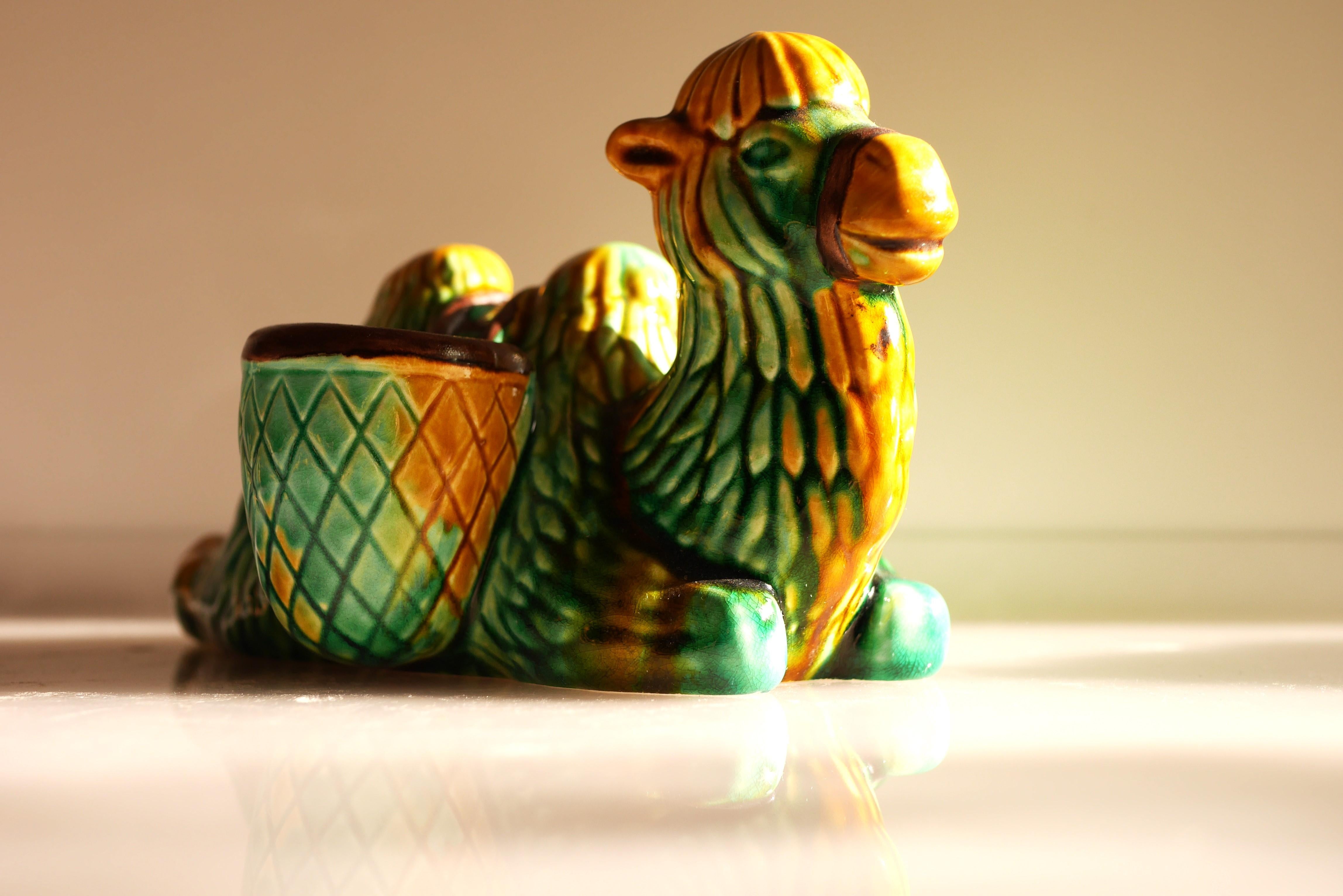 A very rare and stunning vintage porcelain figurine in the shape of a camel stoneware design by very talented Gunnar Nylund for Rörstrand. This is a gorgeous piece and fun, originally mostly used as a quirky toothpick holder, which has and