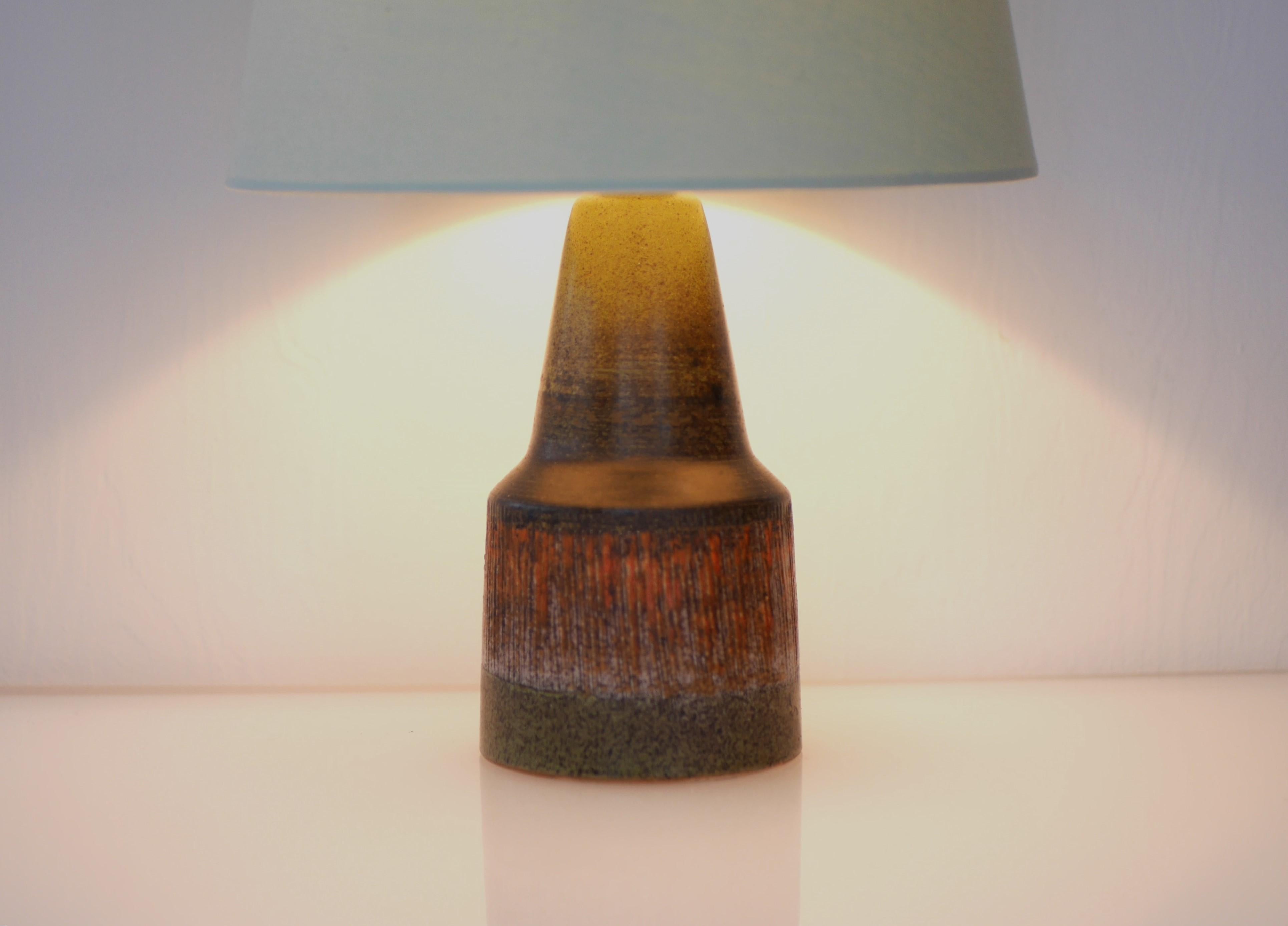 A very special ceramic lamp base from Tilgmans, Sweden. This lamp is very typical of his style when it comes to patterns and glazing from the 1970s. The design is simple and honest, yet it is glazing and the colors which makes it rather special. The