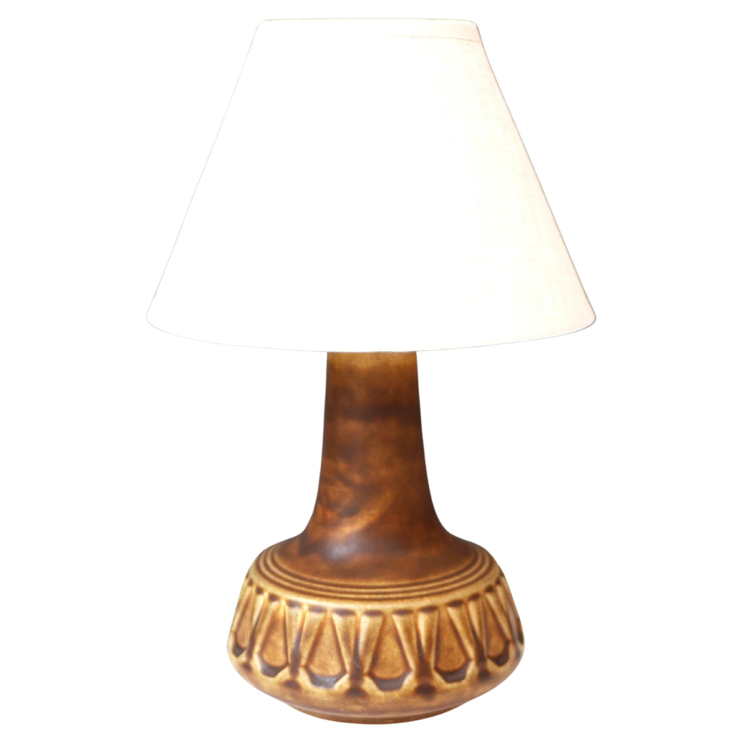 A very cute little vintage handmade ceramic stoneware lamp base made from Söholm, Denmark. This lamp is a classic, elegant and timeless lamp. The shape is rather unusual, wide base and slender neck, it has a contemporary feeling, yet it is the