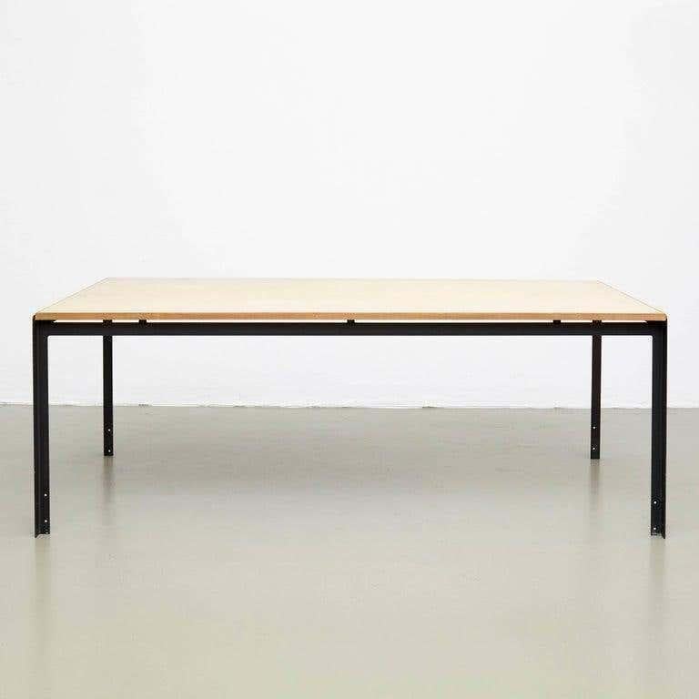 Experience the beauty of Scandinavian design with this stunning professors desk by Poul Kjaerholm, manufactured by Rud Rasmussen in Denmark. The sleek wood and linoleum tabletop paired with lacquered metal legs create a modern yet timeless