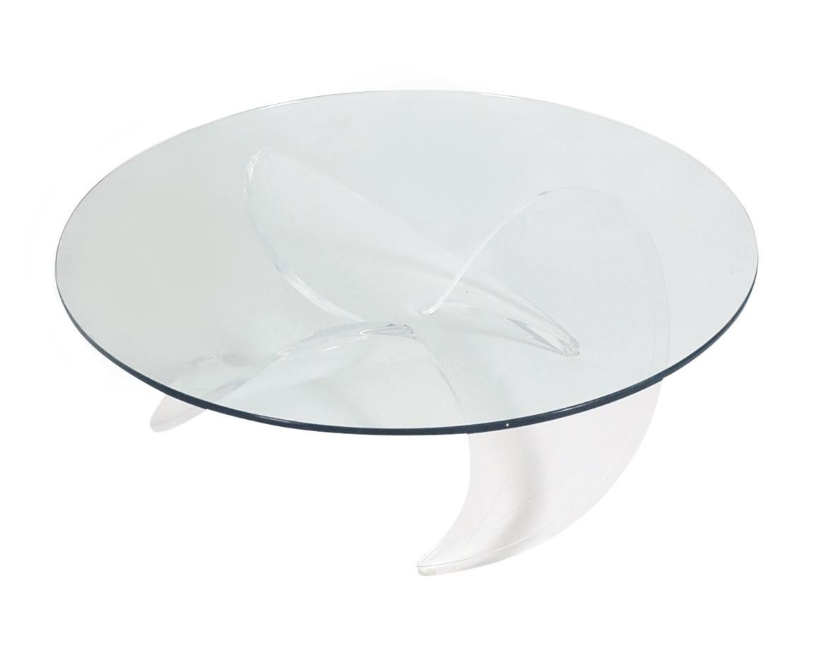 Mid-Century Modern glass propeller coffee table by Knut Hertserberg, 1970, Germany. It features a thick acrylic base with thick clear glass top.
