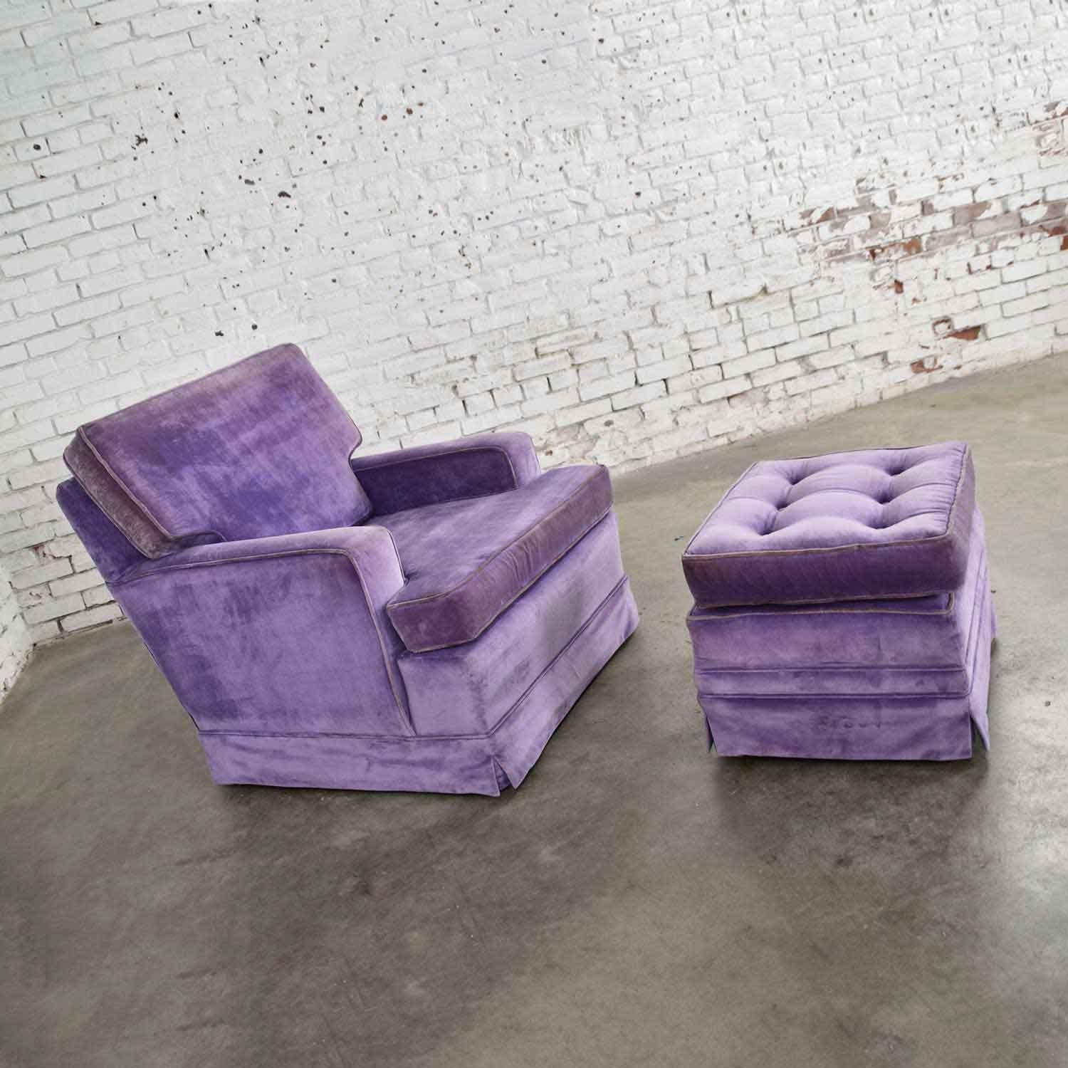Charming purple velvet Mid-Century Modern Lawson style vintage club chair and matching ottoman with button tufted design and loose top cushion. Wonderful age-appropriate condition. The foam in back has been replaced. The fabric is perfectly aged and