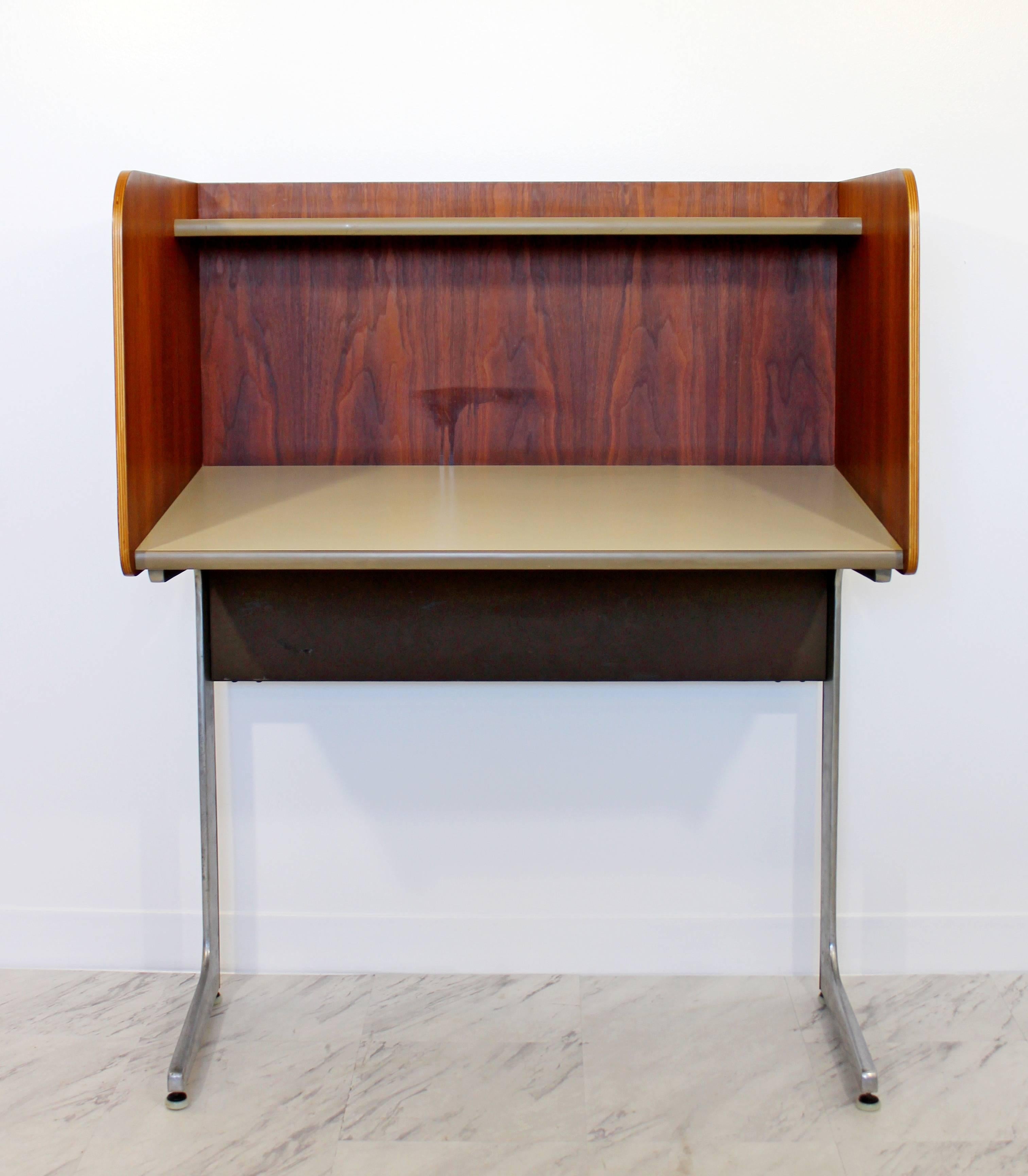 For your consideration is a gorgeous, upright desk, with privacy walls and flap, by Herman Miller, circa the 1960s. In excellent condition. The dimensions are 36