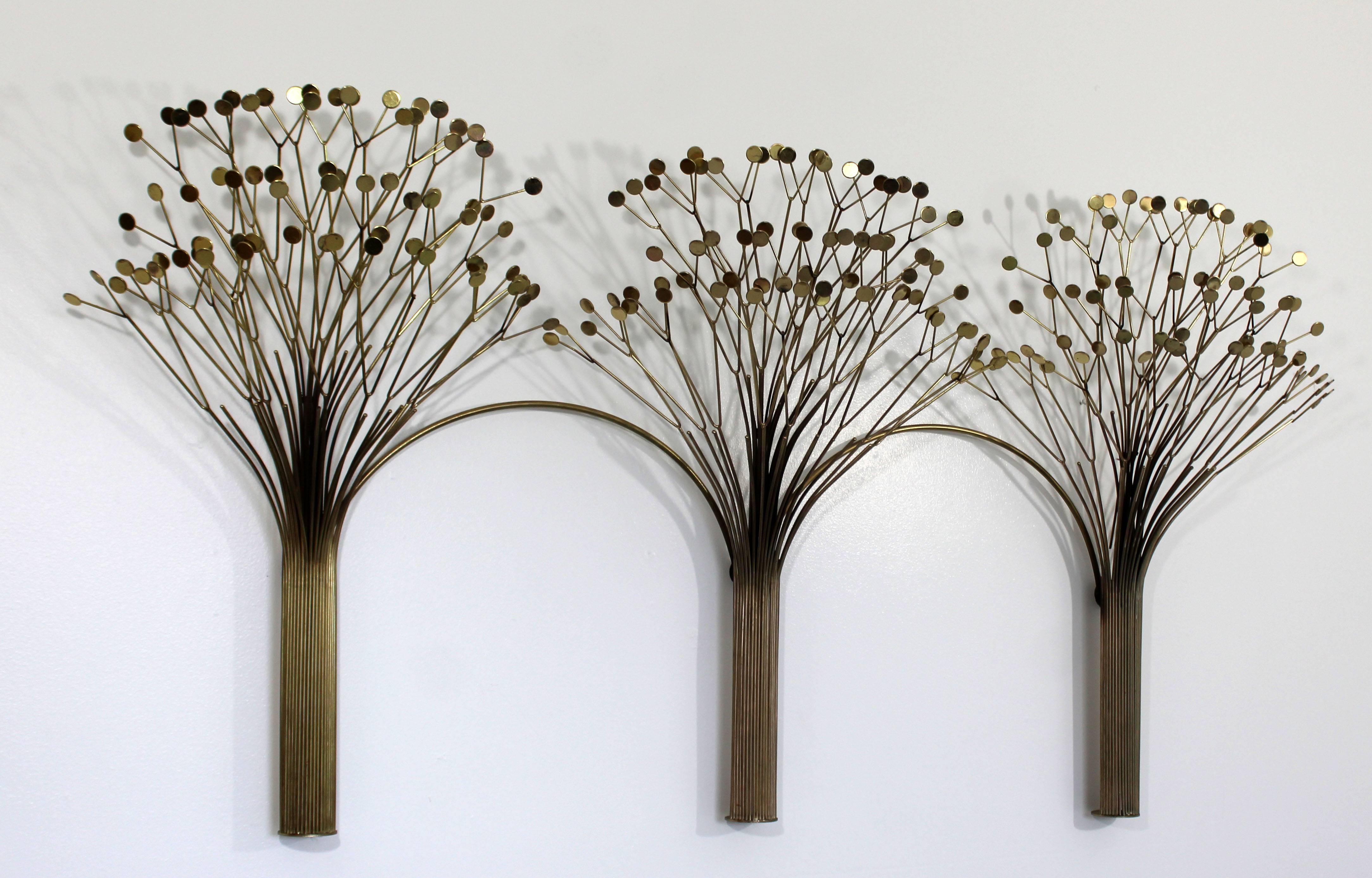 For your consideration is a spectacular, brass wall sculpture of three trees, signed Curtis Jere and dated 1971. In excellent condition. The dimensions are 64