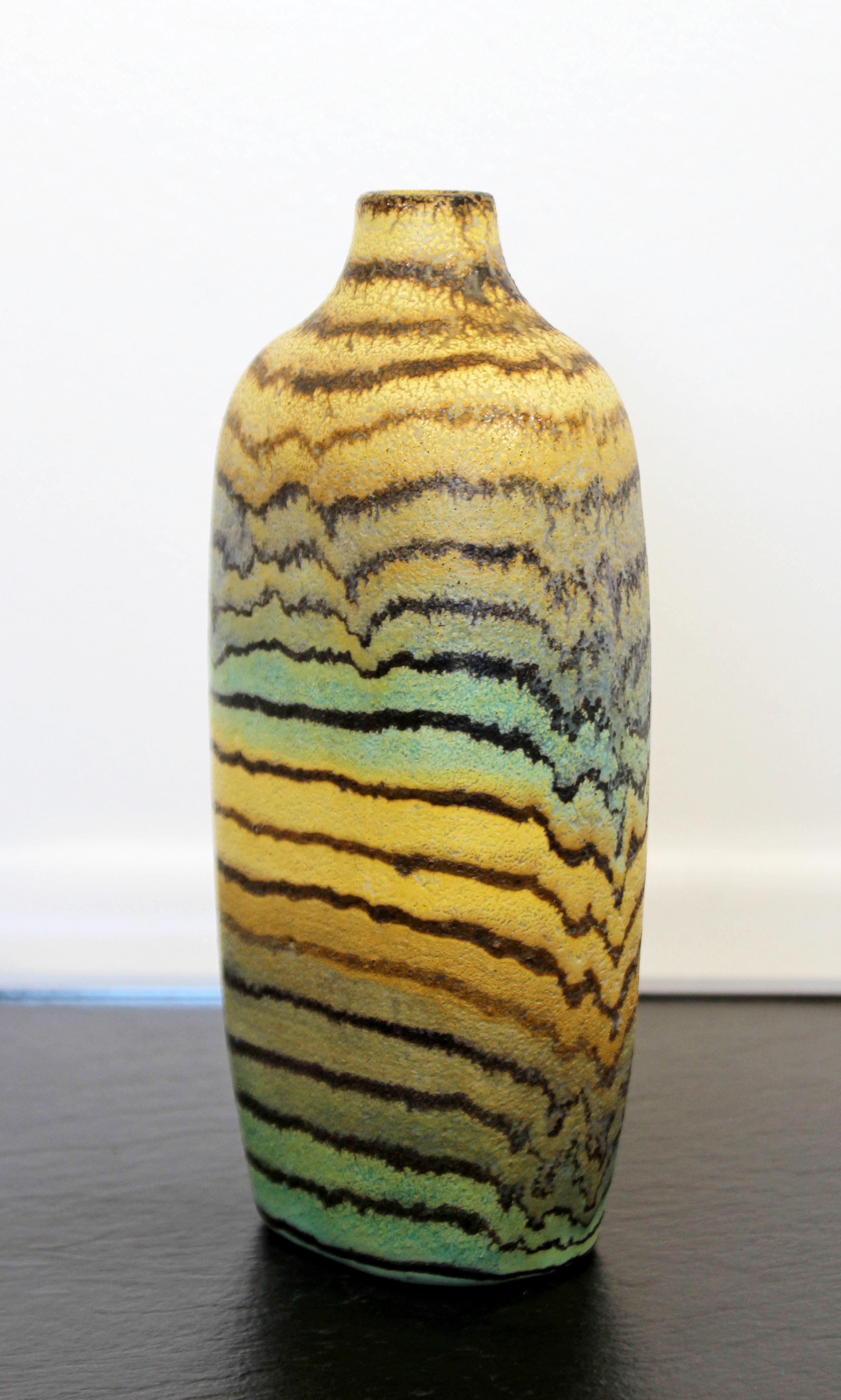 For your consideration is a magnificent and rare, ceramic art vase or vessel, signed on the bottom by Marcello Fantoni for Raymor, made in Italy in the 1950s. In excellent condition. The dimensions are 4