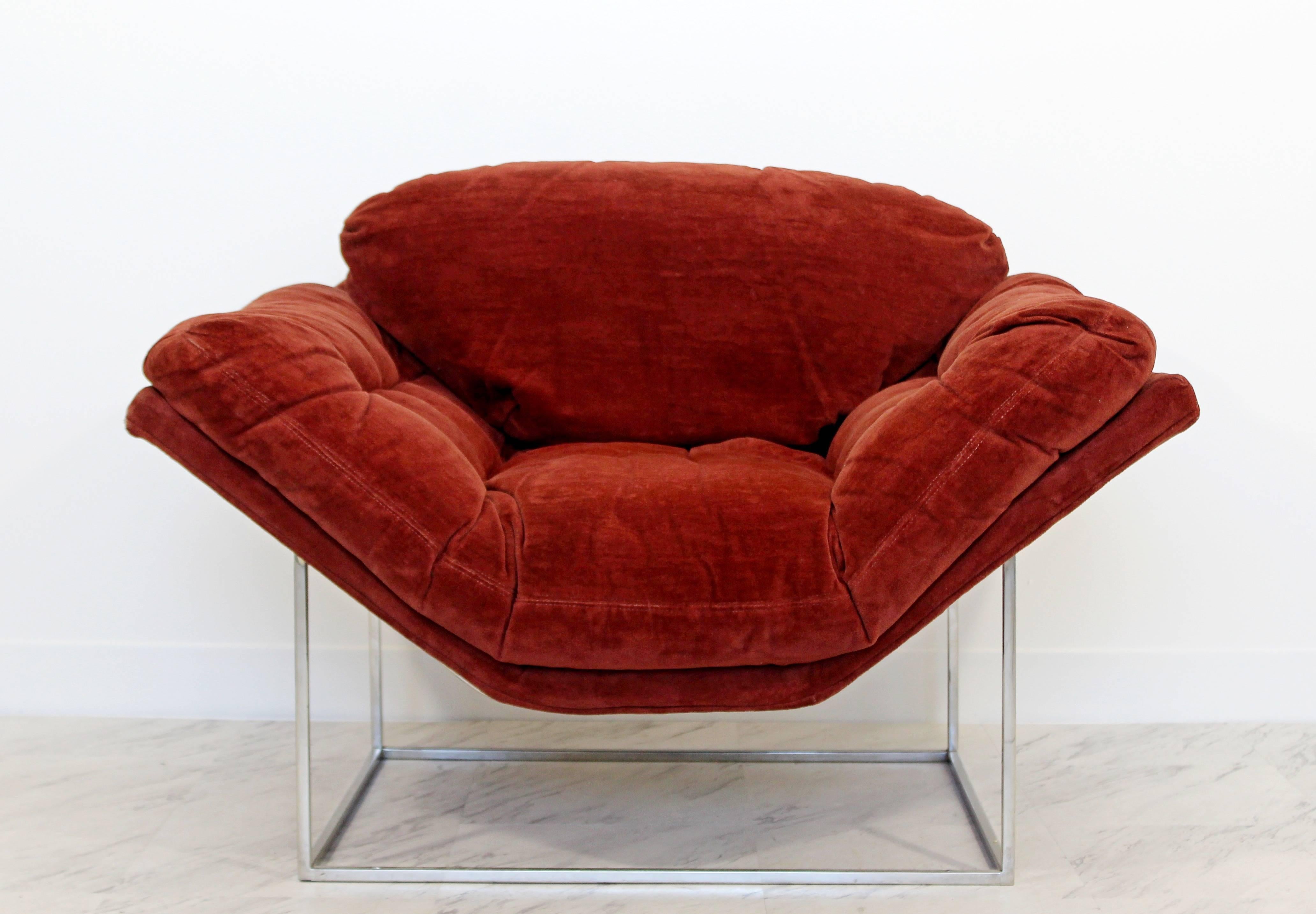 For your consideration is an incredible and rare lounge chair, with a burgundy fabric, practically floating on a thin tubular chrome base by Milo Baughman for Thayer Coggin, circa the 1960s. In excellent condition, but with a couple minor tears in