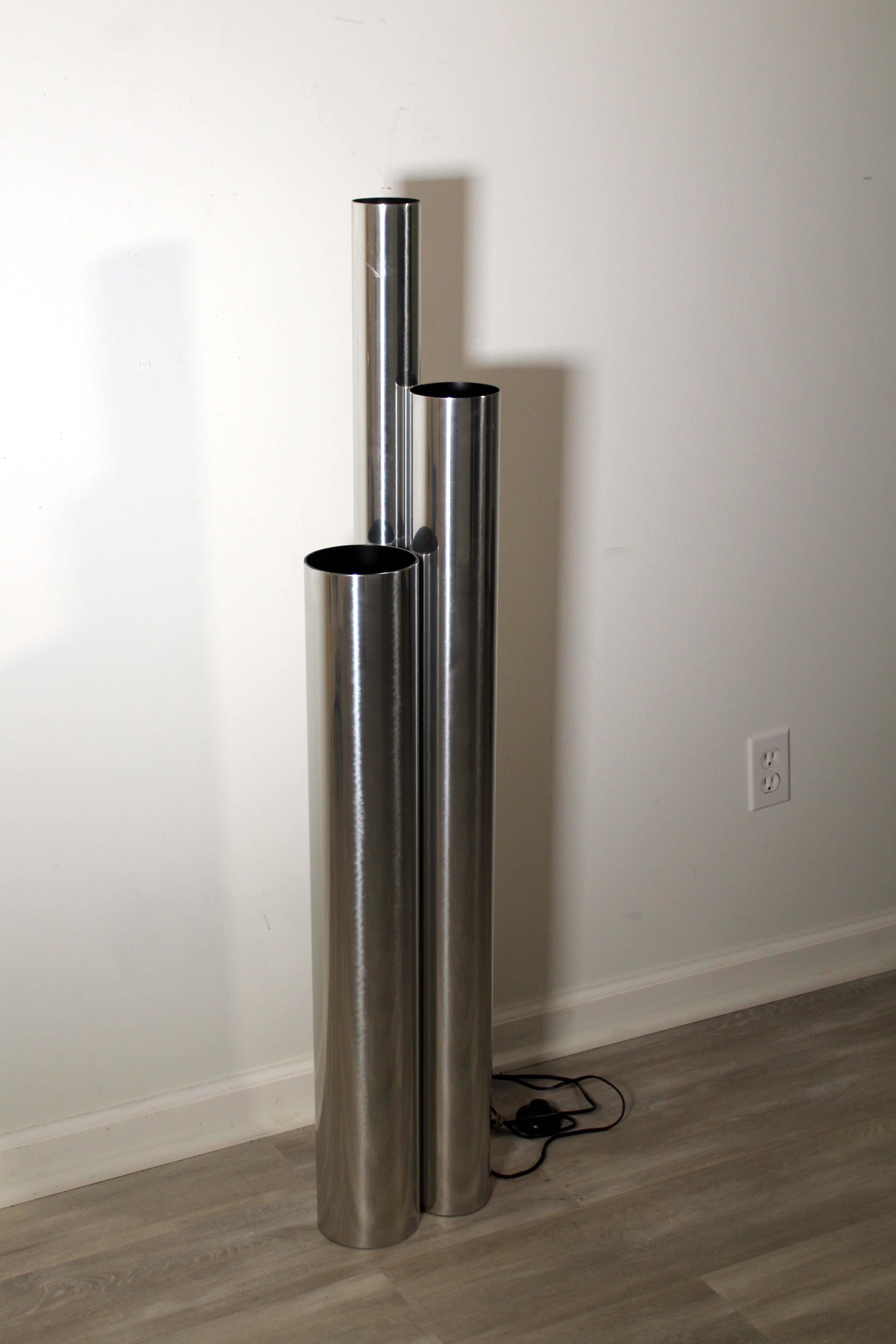 This tubular Robert Sonneman 3 tubed chrome floor lamp is up for consideration. Three different sized tubes combined into one structure gives this floor lamp a unique feel. It would look great in any home it goes to! Pedal to turn on the lamp. In