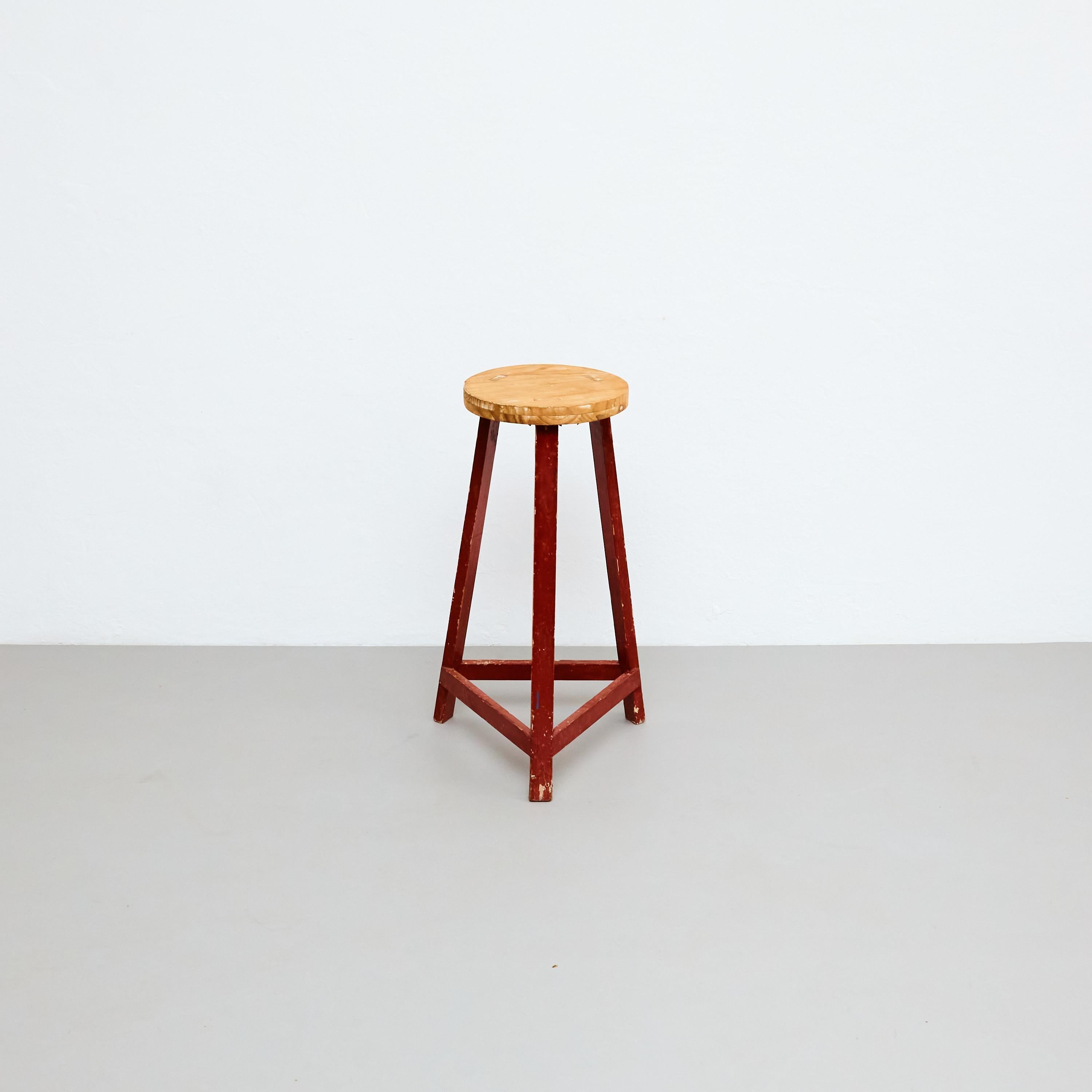 Mid-Century Modern Rationalist Wood High Stool, by unknown designer.    Embrace the timeless style of this Mid-Century Modern rationalist wood high stool, designed by an unknown designer and manufactured in France circa 1950. The stool showcases a