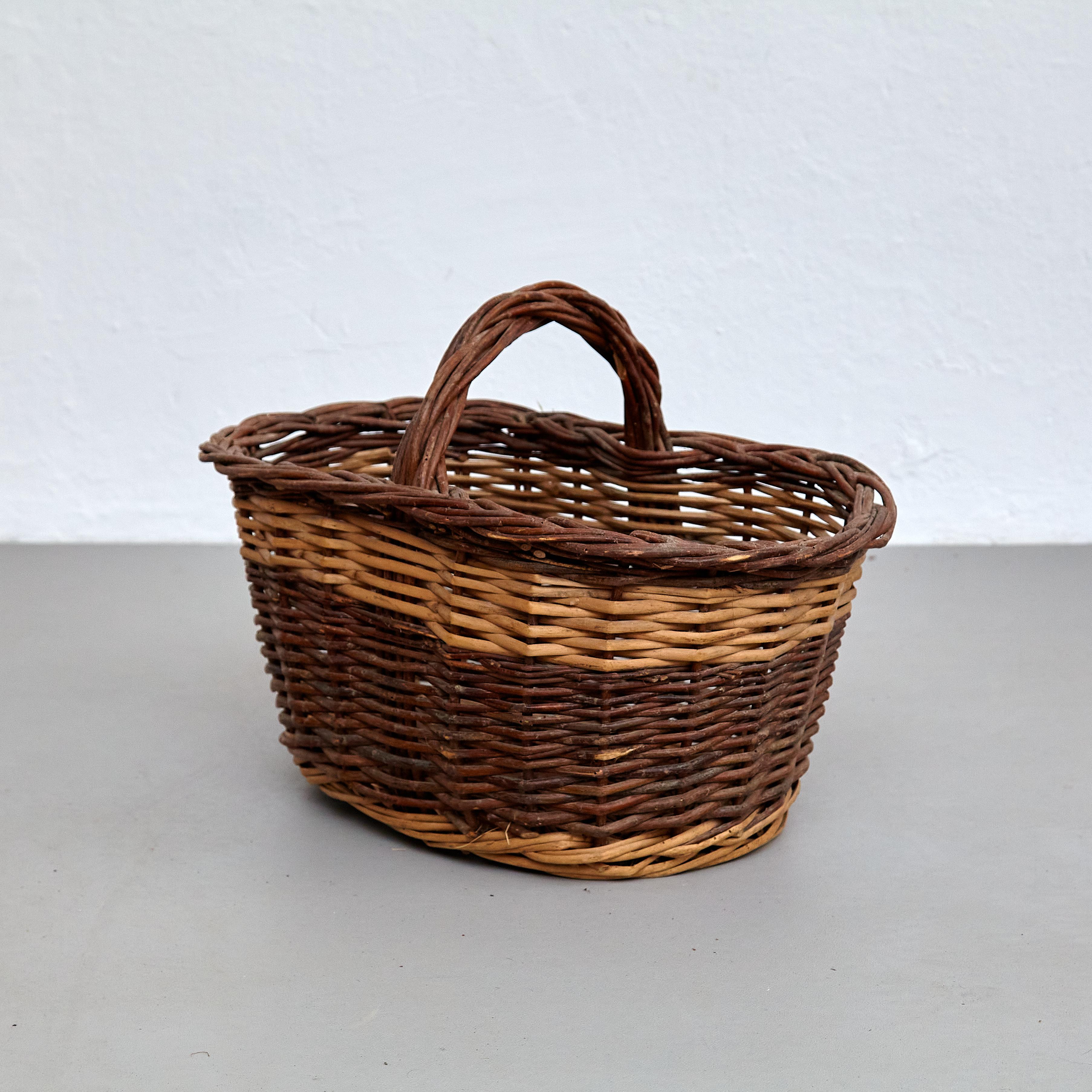 Mid-Century Modern rattan large basket.

In original condition with minor wear consistent of age and use, preserving a beautiful patina.

Materials: 
Rattan 

Dimensions: 
D 35 cm x W 52 cm x H 37 cm.

Important information regarding